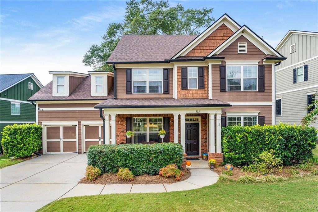Welcome to this beautifully maintained Craftsman-style home located in a gated community just minutes from the vibrant Marietta Square. Offering 5 bedrooms and 3.5 bathrooms, this spacious residence seamlessly blends timeless style, modern updates, and functional design—perfect for today’s lifestyle. Gleaming hardwood floors flow throughout the main level, leading to an open-concept living space that includes a generous family room, formal dining room, den/study, and a gourmet kitchen featuring granite countertops, updated cabinetry, and stainless-steel appliances—including a new refrigerator, microwave, and dishwasher (2024/2025). The redesigned laundry room enhances everyday convenience with a modern, efficient layout. Upstairs, you’ll find newly installed hardwood flooring and carpeted stairs (2024), a large primary suite with en-suite bath, and three additional bedrooms—one with a private bath, ideal for guests or multigenerational living. The third level offers a versatile bonus suite with a fifth bedroom, perfect for a home office, media room, or private retreat. Step outside to a large, fenced backyard complete with a tranquil pond and a stunning mature hardwood tree offering shade and natural beauty. The custom covered porch provides a serene space to enjoy your morning coffee or unwind in the evenings. Additional upgrades include a new roof (2022), new interior paint, updated light fixtures, and thoughtful enhancements throughout. This home offers a rare combination of privacy, elegance, and convenience in a prime location close to shopping, dining, and cultural attractions.