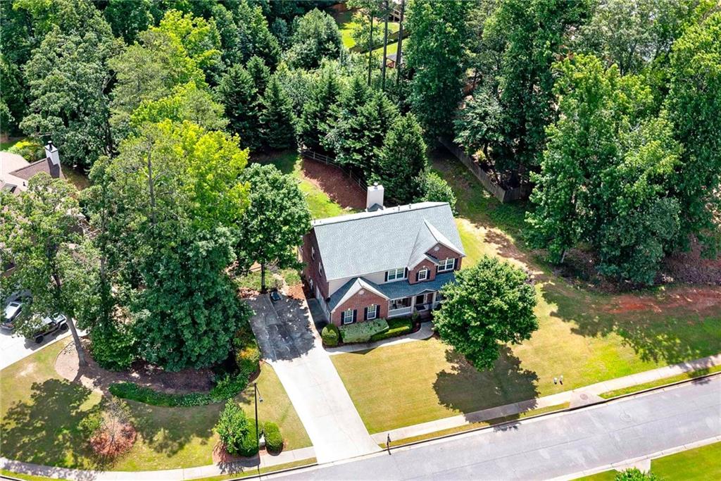 Motivated Seller! Don’t Miss This Opportunity! Welcome to 1120 Bagwell Drive, a beautifully maintained home located in the quiet and charming Belleterre Subdivision, one of the most desirable neighborhoods within the highly acclaimed Kennesaw Mountain High School district. Perfectly positioned on a spacious half-acre corner lot, this 4-bedroom, 3.5-bathroom home offers exceptional indoor and outdoor living. Inside has a grand entryway that opens to a formal living room, dining room, den, and a dedicated office space. The open-concept kitchen, updated in 2023, features a clear view into the living area and includes new stainless-steel appliances all installed in 2023. Upstairs has a luxurious owner’s suite with a sitting area and a spa-like bath complete with double vanities, a tiled shower, and a separate soaking tub. Custom shelving added in 2022 enhances the owner’s suite closet and laundry room. Relax and unwind on the screened-in deck, freshly painted in 2023. Enjoy the finished basement, which includes a full bath, theater room, family room, workshop, fitness/storm room, and ample storage space. Additional upgrades include a new roof (2018), all windows replaced (2016), Nest thermostats for smart climate control, storm doors added in 2024, a new garage door and LiftMaster opener with camera (2022), and a SafeRack storage system installed in the garage (2019). As a rare added bonus, this home includes a 2-year home warranty offering peace of mind for your investment. Conveniently located near parks, shopping, dining, major highways, Kennesaw Mountain National Battlefield Park, and the Marietta Square. Schedule your private tour today!