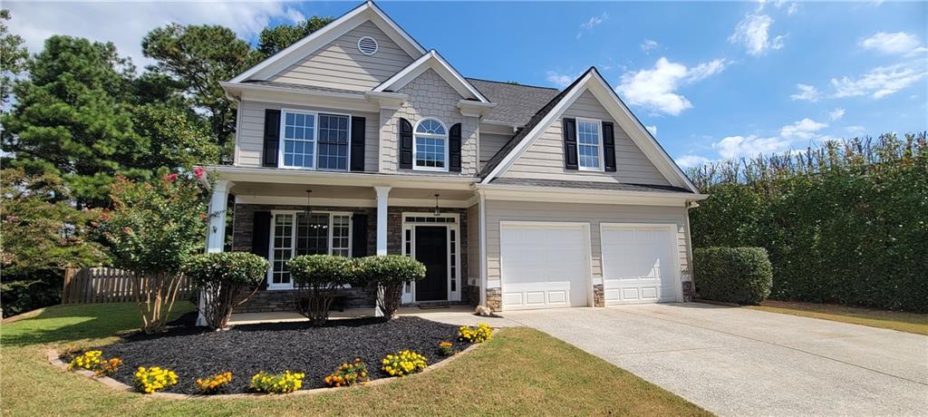 Simply Fabulous in Bridgemill with the Corps of Engineer's land and Lake Allatoona as your neighbor. Minutes to downtown Canton so you can enjoy the festivals and restaurants. Sidewalks for your morning exercise, and peaceful Cul-de-sac location with Happy Neighbors. This 4 bedroom two-story is styled and filled with Craftsman inspired details. There are new luxury vinyl floors, wainscoat accents in the dining room, and a cozy fireplace in the family room. The private yard is completed with wood fencing and an extra large stone patio with trellis styled cover. There is a bedroom on the main level and a full bathroom. Also, there are 2 additional bedrooms and full bathrooms in this split bedroom upper level and an extended primary suite. The primary bath includes a double vanity, separate shower, large closet and soaking tub with window overlook the private back yard. Conveniently placed off the primary suite is a sitting area and an additional nook which would make a perfect office or mini library. His and Her closets. Laundry room is located conveniently upstairs. The Bridgemill community offers affordable HOA dues and numerous amenities. You can choose to join the Bridgemill Athletic club which offers a championship golf course, clubhouse with restaurant, park and two acre aquatic center, playgrounds, volleyball, workout facilities, and 28 tennis courts. This home is a must see. Updates include fresh paint, new HVAC systems, new LBP floors, new carpets, and new dishwasher. Do not delay, tour today!