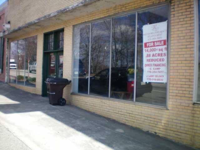 Former Chevy Dealership - Best building in Douglasville. Street frontage on 3 sides. Located in historic downtown - ideal for mixed use. Owner will consider doing most of financing!