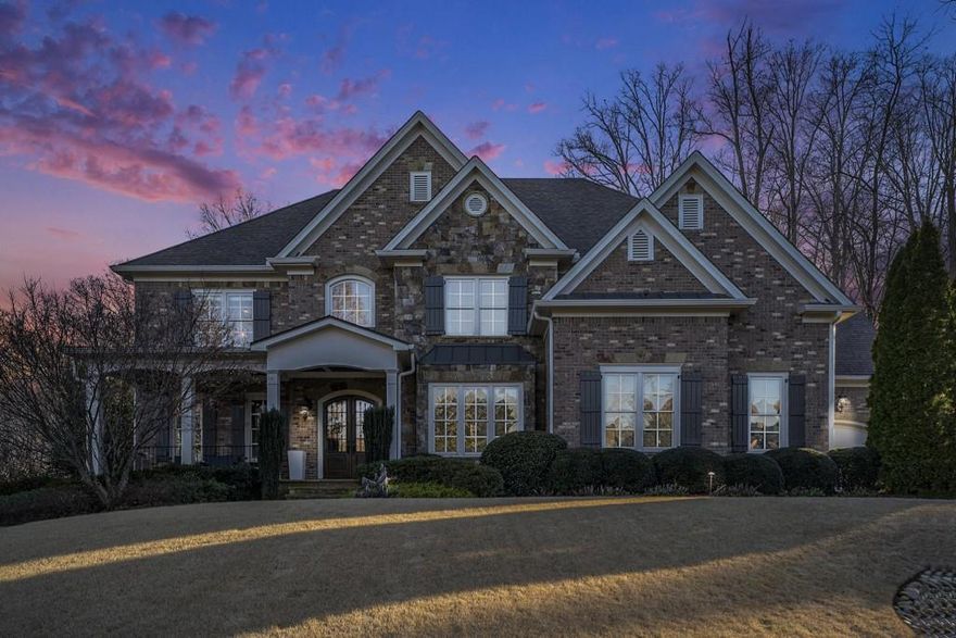 Welcome to 2885 Manor Bridge Drive, an exceptional 6-bedroom, 6-full bath, 2-half bath estate located in Milton's premier gated golf community, The Manor Golf & Country Club. Offering an unparalleled country club lifestyle, this home boasts elegant architectural details, high-end finishes, and resort-style amenities, making it an entertainer's dream and a private retreat. As you enter, you are greeted by custom solid wood front doors, leading into a light-filled foyer flanked by a study and formal dining room. The living room features a coffered ceiling, a stunning stone fireplace, built-in cabinetry, and French doors that open to a screened porch overlooking the private backyard oasis. The chef's kitchen is designed for both function and style, featuring an oversized island, built-in refrigerator, 48" professional gas range, walk-in pantry, and a butler's pantry with a beverage fridge and ice maker. The kitchen flows seamlessly into the vaulted keeping room, where exposed wood beams and a two-story stone fireplace create an inviting space for gatherings. A main-level guest suite with an en-suite bath and separate powder room offers comfort and privacy for visitors. The dream mudroom, with custom cabinets and cubbies, leads to the spacious three-car garage. Upstairs, the owner's suite is a true sanctuary, complete with a fireplace, sitting area, coffee/wet bar, and two custom walk-in closets. The spa-like primary bath boasts an oversized double vanity, a separate tub and shower, and a vaulted ceiling for an airy, luxurious feel. Three additional en-suite bedrooms and an expansive bonus room with built-ins complete the upper level. The fully finished terrace level elevates the home's entertainment offerings, featuring a state-of-the-art home theater, gym, full kitchen with two refrigerators, bar seating, a guest suite with a full bath, and an additional half bath. Outside, the professionally landscaped backyard is a private paradise, featuring a gunite pool, heated whirlpool spa, outdoor lounge area, and ample green space. Living in The Manor Golf & Country Club means access to world-class amenities, including a Tom Watson-designed golf course, a clubhouse, fitness center, resort-style pool, tennis courts, basketball, beach volleyball, playgrounds, and fine dining. With exquisite craftsmanship, luxurious updates, and a prime location in one of Milton's most sought-after communities, 2885 Manor Bridge Drive is a rare opportunity to own an extraordinary home that defines elegance, comfort, and prestige. Schedule your private tour today!