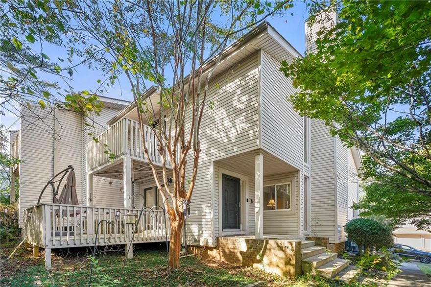 Welcome to this light-filled contemporary retreat in the heart of East Cobb! Soaring ceilings, floor-to-ceiling windows, and an open concept design create a bright, airy atmosphere throughout the main living area. Enjoy gatherings around the modern white brick fireplace or step outside to the spacious double decks, perfect for entertaining or relaxing among the trees. The kitchen features rich wood cabinetry, quartz-style countertops, tile backsplash, and stainless steel appliances. Upstairs, you’ll find a loft-style landing and generously sized bedrooms offering plenty of storage and versatility. Located in a quiet, established community just minutes from shopping, dining, and top schools.