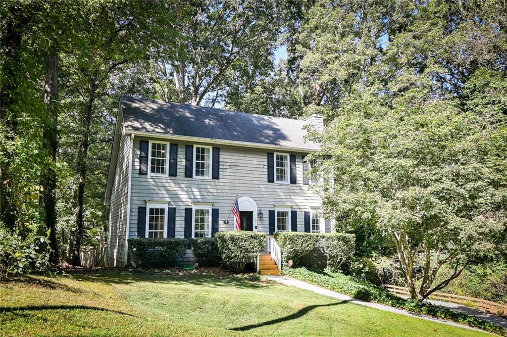 This charming and unique home is located in a NO HOA community and is full of character!! Offers a brand-new heating and air system, an electric car charging station, a new front porch, a new back deck with a fold-out awning, stainless steel appliances and a front-loading washer and dryer and security cameras with a monitor. The main level features a lovely primary suite with a walk-in closet and a newly renovated ensuite. Upstairs, there are two spacious secondary bedrooms and an updated bathroom. The garage/basement provides plenty of storage or potential for extra living space. The backyard is fenced and has a separate fenced area for chickens or other pets along with a storage building. With so many updates, this well-cared-for home is cozy and welcoming!