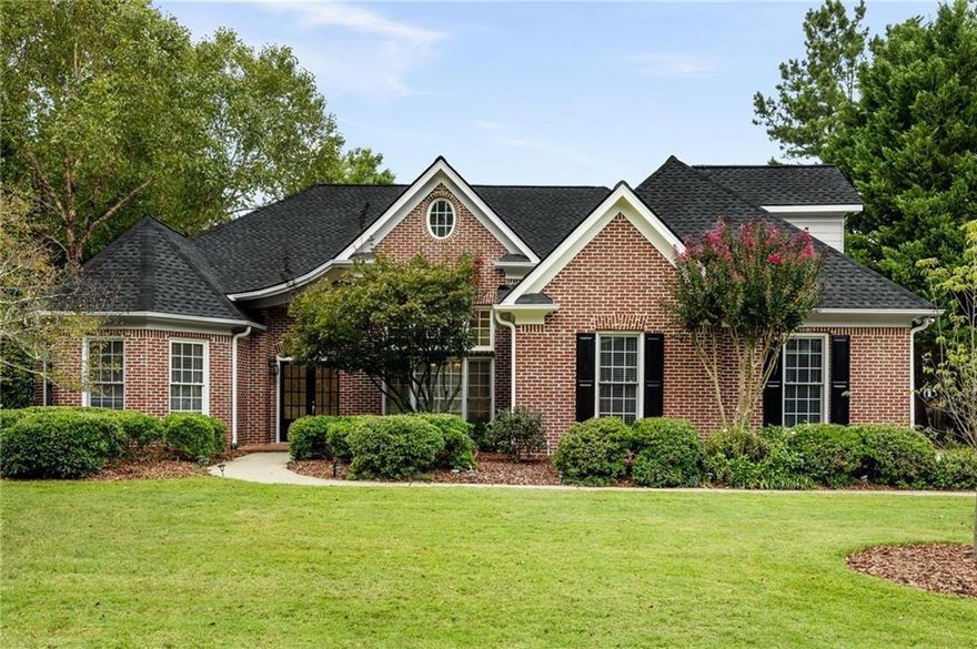 Giving you exclusive access to this exceptional East Cobb executive residence! nestled on a peaceful cul-de-sac and offering breathtaking sunset views. Step through grand double doors into a dramatic great room with soaring ceilings, complemented by a formal dining area accented with elegant wainscoting. Just off the foyer, a distinctive turret-style office with French doors makes the perfect private workspace. Designed for easy main-level living, this home includes everything you need on one floor-except for a spacious upstairs bonus suite, complete with its own full bath. The expansive primary suite features a luxurious bathroom with a jetted soaking tub, separate shower, private water closet, and an oversized walk-in closet that feels like its own wing. A thoughtfully designed split-bedroom layout ensures privacy, with two secondary bedrooms sharing a Jack and Jill bath and featuring custom built-in shelving and storage. The gourmet kitchen is ideal for any home chef, offering a breakfast bar, casual dining space, and open views into a sunroom or cozy keeping room. Direct access to the stepless garage leads to a functional laundry/mudroom and a convenient half bath just off the hallway. Step outside to a beautifully manicured backyard with a charming pergola-covered patio, perfect for outdoor entertaining or relaxing evenings. Recent updates include a brand-new roof, fresh interior and exterior paint, a new water heater, and a new garbage disposal. Every inch of the home including carpets, windows, and screens-has been professionally cleaned. Move-in ready! schedule your tour today!