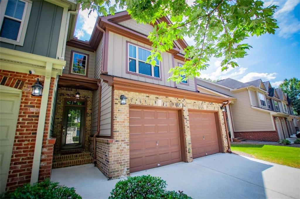 Freshly painted and move-in ready, this 2 bedroom, 2.5 bath townhome offers low-maintenance living with plenty of space and comfort. Step inside to a welcoming 2-story foyer with gleaming hardwood floors that flow throughout the home. The well-appointed kitchen features granite counters, a breakfast bar, and a sunny breakfast room, while the formal dining room provides space for entertaining or everyday meals. The spacious family room is inviting with a fireplace and gas logs, accented by arched openings and trey ceilings that add both character and charm. Upstairs are two oversized bedrooms, each with its own ensuite. The primary retreat includes a versatile sitting area that could double as a home office or reading nook, along with a huge walk-in closet. The luxurious renovated primary bath features dual vanities, a tile shower, and a garden tub. The secondary suite is just as spacious with dual sinks, a large shower, and a walk-in closet-perfect for guests or roommates who value their own space. The gated community provides peace of mind and features a swimming pool for recreation. The HOA takes care of exterior maintenance, lawn care, termite protection, water, and trash service-making homeownership simple and stress-free. All this, just minutes from shopping, dining, schools, entertainment, and easy interstate access for a smooth commute. Don't let this amazing home pass you by, schedule your viewing today!