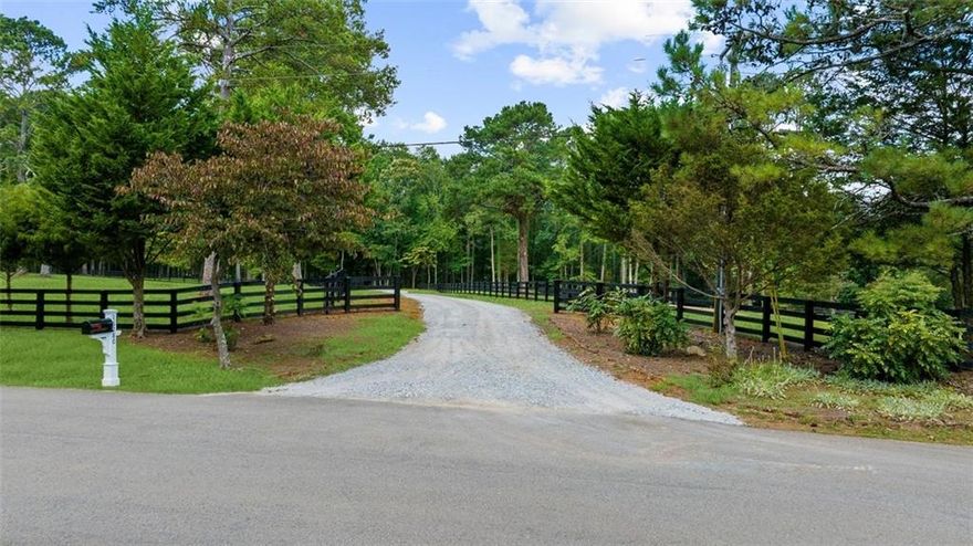 Discover a rare and highly coveted land opportunity in Cherokee county with Alpharetta address! This 10.65 acre tract offers lake frontage, spectacular views, gentle topography and pristine pastures for anyone looking to build a private estate, equestrian facility or hobby farm. There is an existing home on the property that can be renovated or torn down to build your dream custom home!