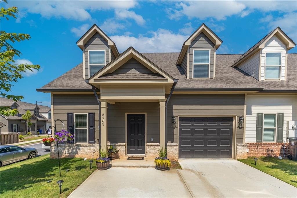 Almost new end unit townhome within the city limits of Gainesville. 2 Miles from Northeast GA Medical Center Gainesville Campus and 2 miles from the rowing venue where there is boat access to Lake Lanier to enjoy everyday. Private backyard with extended patio. This gives you room to grill and sit around while you entertain friends and family. There are no rent restrictions so investors can add this to their portfolio. One car garage w/ driveway wide enough to park two. HOA covers ground maintenance, roof, and exterior siding.