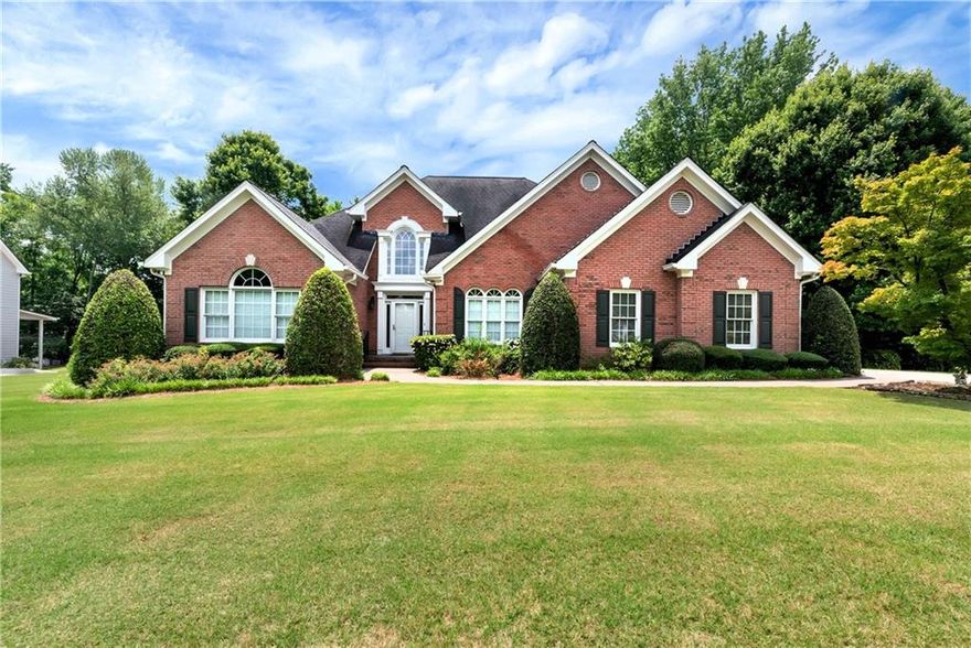 Welcome home to 3885 Lake Juliette Drive in sought after swim/tennis community. Spacious ranch home with 4 bedrooms and 3 and 1/2 bathrooms.  Large fireside family room opens to separate formal dining room. Study with French doors and built-in cabinets is the perfect home office. Home chefs will love the expansive kitchen island - ideal for meal prep, custom cabinetry offers ample storage and the built-in refrigerator blends beautifully into the design for a sleek, high-end look. Whether you're entertaining a crowd or enjoying a quiet breakfast, this space is designed to bring everyone together. Spacious primary suite with large walk-in closet, tiled floor with separate shower and walk-in tub. Split bedroom plan with two guest beds on the main level and shared bath with double vanity. Versatile and generously sized, the bonus-sized bedroom upstairs offers the perfect retreat for guests or teens. This expansive space feels like a second primary suite, featuring a full private bathroom and plenty of room for a sitting area. Nicely landscaped and private yard perfect for relaxing or hanging out. Incredible basement offers tons of square footage and endless possibilities complete with garage door. New roof to be installed, hardwood floors throughout the main floor, fenced in yard, fresh interior paint and more! Great community convenient to shopping and interstates.