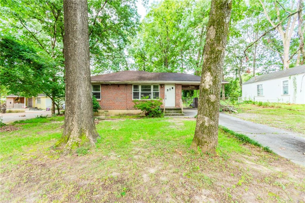 INVESTORS, TAKE NOTICE!
Opportunity awaits in the highly sought-after Forest Park neighborhood! This solid 2-bedroom, 1-bath all-brick ranch sits on a beautiful lot and offers endless potential. Built in 1950, it features a spacious living room just off the kitchen—ideal for expanding your living or entertaining space—plus original hardwood floors, a separate kitchen, and a smart, functional layout.
Enjoy the benefits of four-sided brick construction, a carport, and a large backyard ready to be transformed into your own private retreat. Located minutes from I-75, I-85, I-285, downtown Atlanta, and Hartsfield-Jackson Airport, with quick access to top dining, shopping, and parks.
With great bones and a prime location, this home is perfect for a fix-and-flip or rental portfolio addition. Just bring your vision—TLC will go a long way!