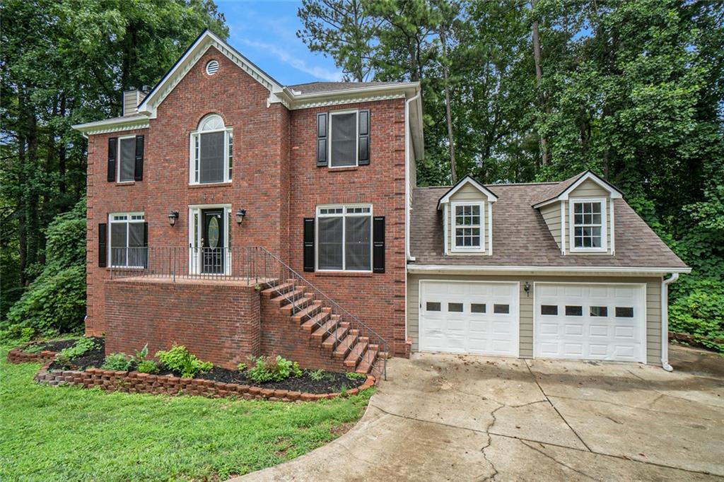 Come experience this 4 Bed/2.5 Bath updated brick home in the cul-de-sac of this unique neighborhood. Renovated from top to bottom- new paint- new carpet – new LVP flooring – new deck. The hardwood entrance is flanked by the living room and cozy family room with a marble face, gas fireplace. The family room flows in an open concept to the kitchen with all SS appliances, granite counters, and an island that has a peninsula breakfast bar. You’ll love to entertain family and friends in your formal dining room. The Primary suite has a double trey ceiling and dual fans, along with his/her private closets and lots of cabinet space in the vaulted, sun-filled primary bath for linens and toiletries. Three other generous bedrooms, including one with a vaulted ceiling, share a full bath with granite counter. The large basement has windows and a private entrance with a soft-mat flooring for exercise, game room, and kids play area or convert it to your man-cave media room. You’ll love summer barbeques on your renovated deck off the kitchen level that flows down to a second deck at the basement. The front faces west so has energy-saving sunscreens on all windows. This home is a blank slate, ready for you to add your personal touches. Seller will provide a standard 2-10 home warranty on appliances, plumbing, and electric for peace of mind. Located in a prime area near shopping, restaurants, schools, KSU and Lake Allatoona. Quick access to I-575, 75, Hwy 92 and downtown Woodstock, this home combines convenience and comfort. Don’t miss out on making this home your own!