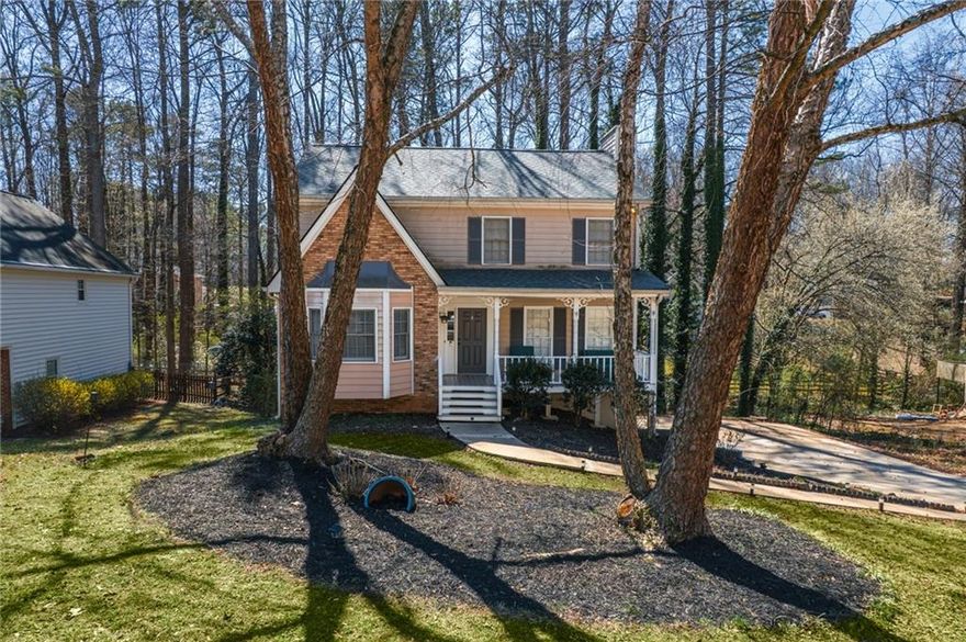 **Charming 4-Bedroom Home Near Kennesaw Mountain**  

Welcome to this beautifully updated **4-bedroom, 2.5-bathroom home** located in the sought-after **Zachary Woods** community, just minutes from **Kennesaw Mountain** and within the highly rated **Kennesaw Mountain High School district**.  

Step inside to find **brand-new sustainable flooring** throughout the main level, along with elegant **high-end tiling in the kitchen**. The kitchen has been completely remodeled, featuring **new appliances, granite countertops, stylish backsplash, and brand-new cabinetry** with upgraded drawer systems for maximum functionality. The home also includes a **separate dining room**—perfect for hosting gatherings.  

Upstairs, the **oversized master suite** boasts raised ceilings, a **walk-in closet with built-in shelving**, and a **master bath with a shower/tub combo**. Two additional bedrooms and another full bathroom complete the upper level.  

The **partially finished basement** includes **new sustainable flooring, ceiling tile, and a track system**, offering extra living or storage space.  

Outside, enjoy the **screened-in porch and fenced backyard**, with the potential to extend the fence to the property line, which reaches the **nearby creek**.  

Additional features include a **two-car garage with a new motor, remotes, and a built-in shelving/workstation**. Plus, residents of **Zachary Woods** can take advantage of the **optional low-cost swim/tennis membership**.  

Don't miss your chance to own this beautifully updated home in an unbeatable location! Schedule your showing today.