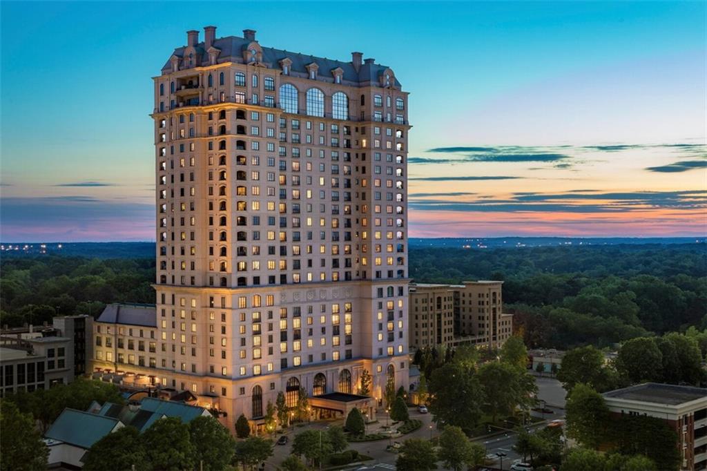 Exceptional residence in the prestigious St Regis Residences, in the heart of Buckhead with the finest amenities available. This home exhibits the ultimate attention to detail from the expansive living spaces to the sophisticated finishes. Unobstructed panoramic views through the walls of windows are enjoyed from every room. Private elevator opens to grand living space with exquisite architectural details, design elements and fixtures. The living room and formal dining room above the city lights are perfect for both daily living and lavish entertaining. The large outdoor space is conveniently accessible from both the living room and the epicurean kitchen.   Lovely master suite features separate living room with stately fireplace and views of the city scape, two massive custom closets, and a separate study. Two additional guest bedroom suites, one with an adjacent living room. Private 4 car garage and two storage rooms. Enjoy access to the finest world class amenities such as the pool, jacuzzi, billiards room and poolside bar in the breathtaking Piazza, athletic club and full-service spa, an on-site hair salon and Atlas dining room.   Offering space, views, and an enviable lifestyle of luxury, this residence is truly exceptional!