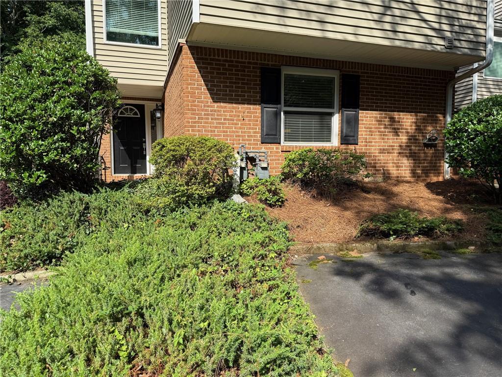 Located in the heart of Perimeter Center and Dunwoody/Sandy Springs area, this end-unit 2-bedroom, 2-bathroom condo features a freshly painted open concept living space with well maintained hardwood floors throughout. This beautifully updated residence is the epitome of convenience, with its all one level living, roommate floor plan and strategic location near GA 400 and I-285 for effortless commuting. The updated kitchen features granite counters and stainless steel appliances and has a privacy outdoor patio for enjoying your morning coffee on one side, as well as a large deck outside the den/office that overlooks a tranquil wooded area. Updated bathrooms. Enjoy a great HOA community with fantastic amenities, including tennis courts, clubhouse with swimming pool and scenic lake. Close to interstate 285 and minutes to downtown Atlanta, this home is just what you've been looking for!