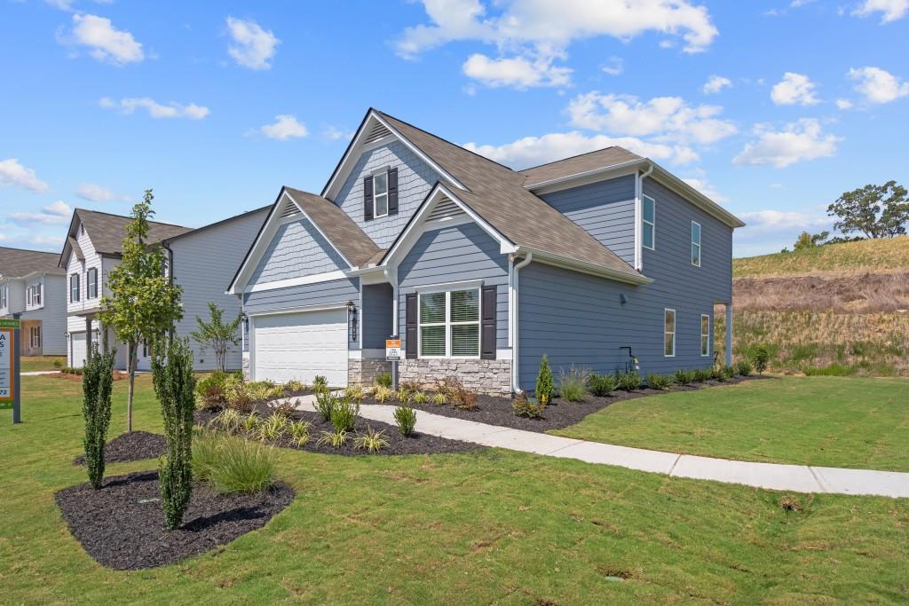 Move in Ready! The Caldwell built by Smith Douglas Homes in Victoria Heights! The Caldwell is a former model home and loaded with upgrades! This plan is ideal for those seeking the convenience of a main-level Primary Suite. A spacious family room with a modern and sleek linear fireplace flows seamlessly into the kitchen and opens to a covered rear porch, creating a comfortable and connected living space. The kitchen has upgraded appliances with gas cooking, upgraded cabinetry including 42" upper cabinets for additional storage, Quartz counters with a tile backsplash. A separate dining room with a tray ceiling is located just off the front entry. Vinyl plank flooring throughout the main living areas on the first floor. All key areas are just steps away including the laundry room with cabinets and washer and dryer. Primary suite has a tray ceiling and a large shower. However, the versatile second floor with iron stair rails offers added flexibility, featuring two additional bedrooms, a full bath and a generous loft. Extra windows have been added in the family room, stair landing, secondary bath and in the loft creating a lovely light-filled home. Both stories have Smith Douglas Homes signature 9ft ceiling heights. Photos of actual home. Seller incentives with use of preferred lender!!!