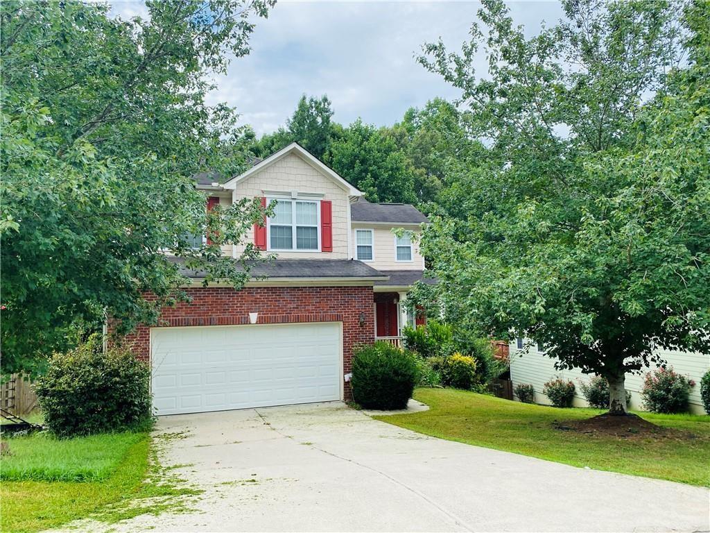 Gorgeous home in south after location..mins from Highway 75, shops, groceries and so much more! SWIM/TENNIS community. Open plan with a GORGEOUS kitchen with upgraded granite, appliances, super sized island! Walk out to a large deck overlooking the woods, flat, useable & private backyard. Open plan with a formal living/dining. Finished basement with ample room for a home theater or simply gaming. Updated bathrooms. A cozy front porch to put those rocking chairs or a swing!!