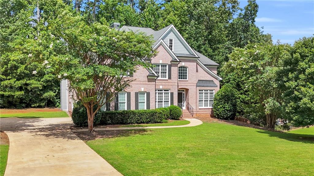 This beautifully renovated 6-bedroom, 5.5-bathroom home is nestled in a desirable neighborhood known for its top-rated schools. The home showcases timeless curb appeal with 3 sides brick, a spacious 3-car garage, and double staircases with iron balusters leading to the upper level, which features four generously sized bedrooms and three full bathrooms. The main level includes a private guest suite with a full bathroom, a separate formal dining room, and a sitting area perfect for entertaining or quiet relaxation. The expansive living room features soaring ceilings and large windows that flood the space with natural light. The kitchen is equipped with stainless steel appliances and opens seamlessly to the main living areas. Upstairs features brand new luxury vinyl plank flooring, while the newly finished basement offers a modern accent wall, a large open space, a sixth bedroom, and a luxurious full bath with a massive walk-in shower. The home also includes stylish modern light fixtures, a new deck, and a large front and backyard offering plenty of privacy. This move-in-ready home combines space, comfort, and modern finishes in a prime location