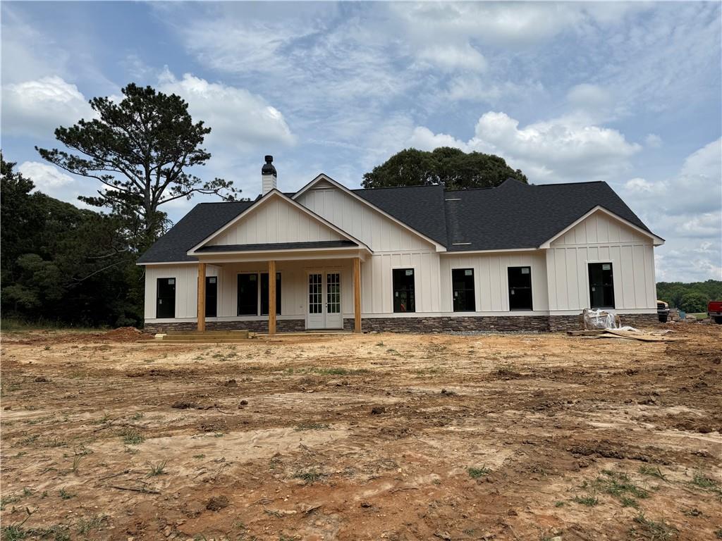 LAKE FRONT PROPERTY sitting beautifully on Lake Jane. NO HOA....new home under construction is the Rosehill floorplan, 4 BR/3.5 BA beautiful Farmhouse Ranch style home on 3.65-acre lot. This home is built on a slab with beautiful features including a stone water table on all four sides with stone accents, black window package, hardi plank siding, rear side entry with 18 ft garage door with opener, 30 Year architectural shingles, 5" gutters. Kitchen with large walk-in pantry, beautiful upgraded wood inset cabinets, island, farmhouse sink, quartz countertops in the kitchen and master bath, granite countertops in the baths, beautiful Cafe brand stainless-steel appliances including a range, dishwasher, microwave AND refrigerator. Dining Room with 10 ft ceilings, Spacious Living Room with fireplace and open concept plan,Office, split bedroom plan,finished bedroom with full bath upstairs, ceramic tile flooring in baths, hardwood flooring throughout. Master bathroom has his/her split double vanity, ceramic tile shower, huge walk-in closet. Upgraded closet systems throughout. This home will feature a 12 ft dual bifold door (3 pane sliders each 4 ft in size that will give you an open 12 ft door area) that opens to the covered rear back porch area with flag stoned flooring with a breathtaking view of the lake. Closing attorney is Bagby Law in Dallas, GA. When using the preferred lender, Marybeth Zimmerman with SWBC Mortgage the buyer will receive a $3,000 credit towards closing costs from lender*****Builder may make changes/substitutions****. *****plan shown is rendering and some changes made be made by the builder****.