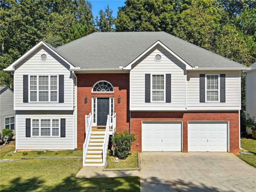 Welcome to this one of a kind Kennesaw charmer, located in the heart of the best shopping, dining, recreation at Kennesaw Mountain and minutes from Kennesaw State University! This beautiful 4 bedroom home has been thoughtfully updated throughout! From the moment you walk in you are greeted by a bright foyer with newly carpeted steps! Head upstairs to a spacious living room with vaulted ceilings, and cozy wood burning fireplace with gas starter and marble surround. Continue through the formal dining room into the vibrant kitchen boasting granite countertops, natural stone backsplash and stainless steel appliances! The Refrigerator is included! Completing the main level is a luxurious primary suite, with a huge walk-in closet and modern bathroom offering a double vanity adorned with marble countertops, separate tub and walk-in shower with decorative tile and glass shower door! There's two additional bedrooms upstairs with new paint that share a stunning, vintage style secondary bathroom with freestanding, clawfoot bathtub w/ English telephone style handheld faucet typically only found in the most prestigious homes. Downstairs, there's a versatile, finished flex space- the perfect 4th bedroom or potential home office, gym or media room. Also featured is a well appointed laundry closet with laundry sink and FULL SIZE stackable washer and dry that are also included! Plenty of unfinished space, stubbed for an additional bathroom offers additional storage space or could be finished to suit your needs! This lot is nestled near the end of a quiet cul-de-sac for a peaceful evening stroll, or enjoy the serene outdoor space on one of the two decks overlooking the wooded landscape. The neighborhood amenities include a Swimming Pool and Tennis Courts make this home the one that HAS IT ALL!