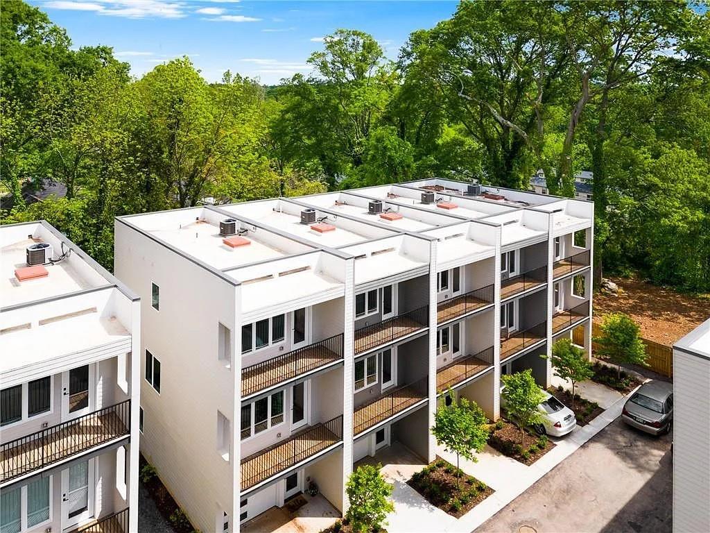 Luxury Living Redefined: Exquisite 3-Story Townhome in Prime Atlanta Location ~ Experience the perfect blend of modern elegance and sophisticated design in this stunning three-story townhome located in the heart of Atlanta. From the moment you enter, you're welcomed by an open, light-filled floor plan that exudes style and comfort. The chef's kitchen is a true masterpiece, featuring custom soft-close cabinetry, pristine quartz countertops, and a beautifully designed tile backsplash. Outfitted with a gourmet 30-inch, 5-burner range, convection oven, and matching hood vent, this kitchen is every culinary enthusiast's dream. The expansive owner's suite is a serene retreat, complete with a spacious walk-in closet and a spa-inspired bathroom. Indulge in the frameless glass shower, featuring a rainfall showerhead and hand sprayer, and enjoy the dual quartz vanities that bring both luxury and functionality together. Every detail has been thoughtfully designed to provide a sense of relaxation and refinement. Enjoy outdoor living at its finest with private balconies on every floor, perfect for morning coffee, evening sunsets, or entertaining friends. This home is as efficient as it is beautiful, offering two high-efficiency HVAC systems with programmable thermostats on each level, Energy Star appliances, and a high-efficiency water heater, ensuring both comfort and cost savings. Refrigerator, Washer & Dryer included! Located in an unbeatable location, you'll love being steps away from some of Atlanta's top restaurants, shopping, and entertainment. Enjoy unparalleled access to the city's best destinations just one mile from East Atlanta Village and Edgewood Shopping Center, 1.5 miles from Pullman Yards, one mile from the Beltline, less than two miles from Krog Street Market, and under a mile from Madison Yards. Pets are considered on a case-by-case basis, making this home perfect for anyone seeking both style and flexibility. Don't miss your chance to experience luxury living reimagined schedule your private tour today!