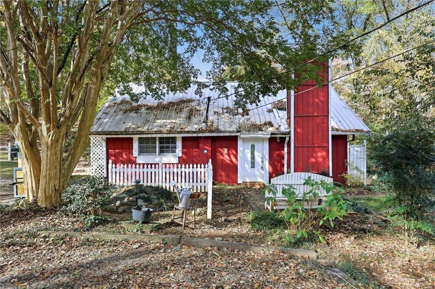 Discover an affordable opportunity on Lake Lanier with this 3-bedroom, 1-bath FIXER UPPER home located in Forsyth County. This property sits adjacent to Corps of Engineers land and offers seasonal lake views and a private, wooded setting. While there are no dock rights, the location provides convenient access to Lake Lanier.  The home is being sold AS-IS and is ideal for buyers seeking a renovation project or investment opportunity.  The existing floorplan features a family room, kitchen with dining area, three bedrooms, and one full bath—ready for your vision and improvements. Outside, the property full of potential for outdoor living spaces, weekend getaways, or full-time residence after updates. With its sought-after location and a price point rarely found this close to the lake, this home offers exceptional value for anyone looking to customize their own Lake Lanier retreat. Sold AS-IS.