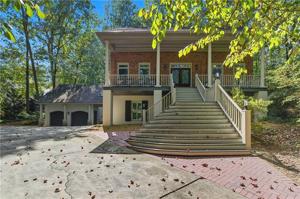 Unique 2-Story Home on a Private almost acre Wooded Oasis in sought after Roswell. Tucked away at the end of a long driveway, this beautifully maintained home offers privacy, charm, and plenty of upgrades. Step inside a spacious foyer that opens to a formal dining room and an oversized family room with a wall of custom built-in bookcases. The main level features refinished hardwood floors, while the upstairs boasts new hardwoods and the finished basement includes new durable LVP flooring. The updated kitchen is a chef’s delight with white cabinetry, granite countertops, kitchen bar area, double ovens, and a sunny eat-in breakfast nook. The owner’s suite is a true retreat with its own fireplace, walk-in closet, and spa-like bath with an additional walk-in closet and linen closet. Upstairs also includes a convenient laundry room and two secondary bedrooms connected by a Jack & Jill bath. The finished basement provides flexible living space with a media room, bedroom, full bath, and storage room. A garage apartment—ideal for future finishing or use as storage—adds even more potential. Enjoy outdoor living on the new brick patio surrounded by mature trees, with fresh exterior paint, new front entry steps, 2 newer HVAC’s (replaced in 2022), and a newer roof replaced in 2016 with 30-year architectural shingles for peace of mind. Neutral paint throughout makes this home truly move-in ready. Located in the sought-after Roswell High School district and just minutes from shopping, dining, and everyday conveniences—this property offers both lifestyle and location!