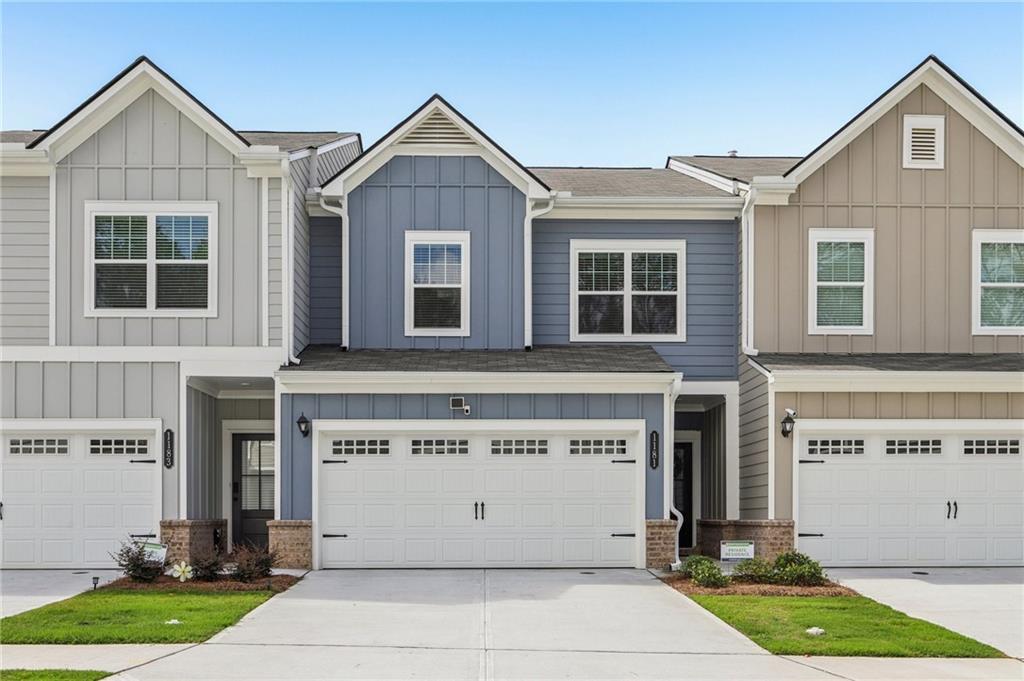 Listed by Mano Sells Homes: Live stylishly and comfortably in this gorgeous NW orientation townhouse nestled in the sought-after Ellison Square community of Sugar Hill, GA. Bursting with natural light and thoughtfully designed, this home proves you can have both space and style. The open-concept floor plan delivers effortless flow, with upgraded vinyl plank flooring stretching across the main level. The kitchen is a showstopper-granite countertops, modern stainless steel appliances, and beautiful cabinetry combine for a space that's as functional as it is beautiful. Upstairs, you'll find generously sized bedrooms, including a serene primary suite with a spa-like bath featuring a large walk-in shower, double vanity, and a linen closet for added convenience. Nine-foot ceilings on both levels enhance the spacious feel throughout. Enjoy your morning coffee or evening unwind on the covered rear patio, and leave the lawn maintenance to the HOA-it's covered! Just minutes from Downtown Sugar Hill and Lake Lanier! Close to shopping, top-rated schools, and scenic trails, this one checks every box. Don't miss your chance to live in one of Sugar Hill's most convenient and charming communities!