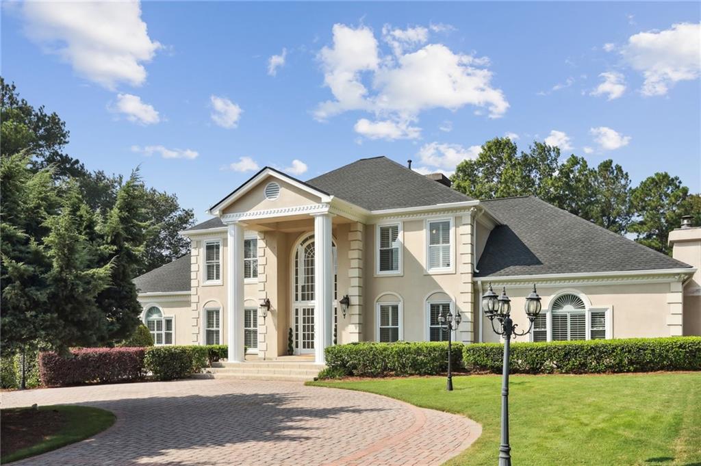 HUGE price improvement of $190K! Don't miss this stunning custom built home nestled on a quiet cul-de-sac off of coveted Columns Drive in Atlanta Country Club. This private gated estate boasts 1.2 acres of lush landscaping equipped with all the amenities to entertain your guests and sports enthusiasts including lighted tennis court/pickleball/basketball court, salt water pool/spa surrounded by welcoming patio area. Plenty of parking for guests inside the gate with a circular drive and parking pad. Elegance abounds throughout this European designed home with modern accents embracing the natural light. Travertine/marble floors compliment the beautiful archways throughout the main level creating a wonderful flow for entertaining. The European kitchen is an aspiring gourmet chef's dream with new ZLINE gas range. Walls of custom cabinetry, storage, and an island that spans the length of the kitchen providing an abundance of prep space. Very spacious dining area in the eat in kitchen for casual entertaining along with a separate formal dining room that easily seats 12+. French doors lead from the kitchen to your outdoor private pool/spa with patio and level greenspace to truly enjoy outdoor living. The main level master suite also allows for one level living convenience. Upstairs you will find 4 very spacious bedrooms that share 2 Jack and Jill baths with separate vanity areas for each bedroom. Pocket doors add additional traditional charm to this home. Updates include fresh neutral paint throughout including doors and moldings and exterior trim, new carpeting upstairs, new light fixtures, updated door hardware, newer windows, custom 3 inch shutters throughout, roof replaced in 2021, new garage door, new mechanical arms for front security gate, new fireplace surround in living room, and several new HVAC units all serviced 8/23. This home boasts 3 fireplaces to keep you warm on those wintry nights. Finished basement with new wide plank LVP flooring and updated full bath leading out to the tennis court for added convenience. All of this along with the easy access to interstates, Sandy Springs City Center, Historic Roswell and the Perimeter. Just a short stroll to the state park to enjoy the trails for running, hiking, mountain biking, walking or a quick kayak ride on the river. Highly rated schools - Sope Creek, Dickerson, and Walton. Agents please see private remarks. Listing agent must be present for showings.
