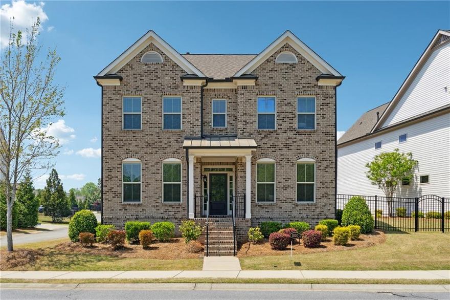 EAST Facing house - Discover a stunning blend of comfort and style in this home nestled in the gated community of Central Park at Deerfield just minutes from Halcyon and all the amenities that Alpharetta has to offer. This nearly newer construction, built in 2018, has everything you want with its open floor plan with custom touches/upgrades throughout. This happy home provides abundant natural light and 10' ceilings all while hosting the largest fenced backyard in the neighborhood. You'll love the seamless flow between dining, entertaining, and cooking in the spacious and bright kitchen. With a main-level bedroom and a full bath, offering privacy and convenience for guests, in addition a separate office space ideal for working from home. Upstairs you will find the oversized primary suite: a true sanctuary with space for a sitting area plus a huge bathroom including double vanity and seamless shower. Tons of storage and closet space. Large secondary bedrooms and separate laundry room conveniently located close to bedrooms. Jack and Jill bathroom upstairs, full backsplash to the ceiling in the kitchen. Quartz kitchen countertop and Marble countertops in all bathrooms. Walking distance to the pool, tennis court and playground, Scenic front view, Jacuzzi in the master bath upstairs and downstairs. Attached 2 car garage, Large fenced side yard.  Maintenance-free landscaping, managed by the HOA, ensures you spend more time enjoying life. The community's amenities, include swim/tennis, playground, clubhouse, and 13 acres of green space, catering to outdoor enthusiasts. With sidewalks throughout and walking trails, you can take leisurely strolls through the neighborhood. Yoga studio and dog groomer located steps from the community. You’ll have quick access to downtown Alpharetta, Avalon, and Halcyon providing tons of restaurants and shopping.