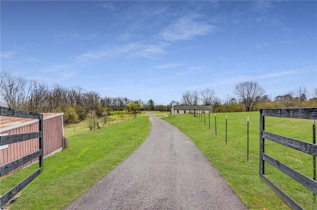 Discover the perfect opportunity to create your dream home on two beautiful acres of land with no HOA! This spacious and serene property offers the ideal setting for your vision — bring your own blueprints or choose from one of the stunning custom home options offered by our experienced builder.
Enjoy the flexibility to design a home that perfectly suits your lifestyle, surrounded by the natural beauty that two acres provides. Whether you envision a modern farmhouse, a timeless traditional, or a contemporary retreat, the possibilities are endless.
Located in an extremely desirable area with easy access to GA400, North Georgia Premium Outlet Mall, and all other needed attractions; this property combines peaceful living with everyday convenience. Don’t miss the chance to create the home you’ve always dreamed of in a location you’ll love!
Highlights:
-2+ Acres of gorgeous, buildable land
-Bring your own blueprints OR choose from our custom home plans, to be built by our experienced builder
-Private, serene setting with room to create your ideal layout
-Endless possibilities to design a home that’s uniquely yours
-No HOA
- Photos of Homes listed are the builders previous builds which are possible options.