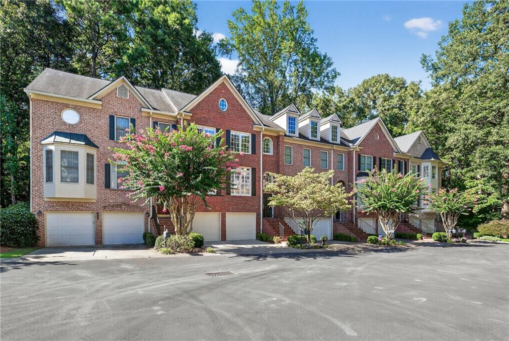 Spacious townhome nestled in a quiet, gated Brookhaven community! This 3-bedroom, 3.5-bathroom home with a 2-car garage offers a bright and inviting layout perfect for everyday living and entertaining. A 2-story foyer welcomes you with abundant natural light. The main level features a separate dining room and a kitchen with white cabinetry, stainless steel appliances, a large pantry, and views into the open family room with a cozy fireplace. Step outside to the deck and enjoy private wooded views, ideal for relaxing after dinner. Upstairs, the owner’s suite boasts a spa-like ensuite with a double vanity, freestanding tub, and shower, along with a built-in walk-in closet. A secondary bedroom with its own ensuite bath and the conveniently located laundry room with storage complete the upper level. The terrace level offers a flexible space that can serve as a third bedroom, office, or media room, featuring a full bathroom and two additional closets for plenty of storage. Enjoy being within walking distance of Murphey Candler Park and close to top-rated schools, shops, and restaurants in both Brookhaven and Chamblee. Easy access to I-285, I-85, and GA-400 makes commuting a breeze.