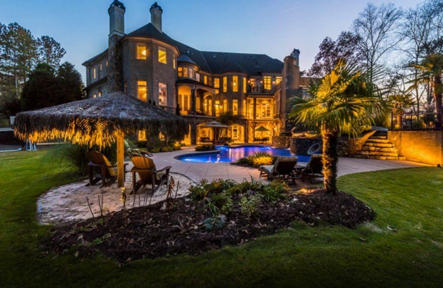 Newly renovated estate on 3+ acres secured by double iron gates for the ultimate privacy and protection. Property overlooks beautiful woods and pastures and is perfect for entertaining and resort-style living, includes access to acres of deeded trails, a rare find in Milton! Built and renovated by Atlanta's #1 luxury custom homebuilder. The open floor plan features a grand master wing, his and her offices and 11 fireplaces POF required for all showings.