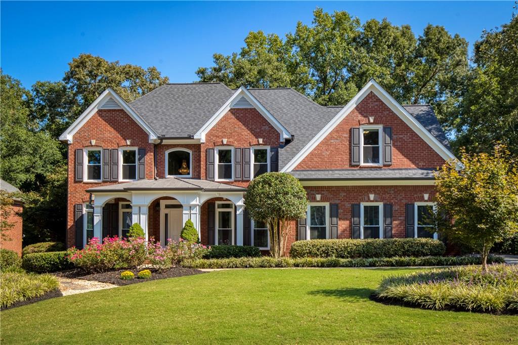 Nestled on a private, level, and wooded .70-acre lot, this exceptional residence is in the prestigious and highly desirable Vinings Estates community, known for its resort-style amenities and upscale living. Meticulously maintained, this stunning three-sided brick home offers more than just a place to live—it offers a lifestyle of luxury, comfort, and convenience. The open floor plan welcomes you into a grand two-story entryway leading to into a spacious entryway with a stunning crystal chandelier, enjoy gatherings in the formal dining room with a sparkling crystal chandelier, a dedicated office, and enclosed sunroom—perfect for a home office, reading nook, or quiet relaxation. The gourmet kitchen is a chef’s dream, featuring freshly painted cabinetry, sleek new quartz countertops, premium stainless-steel appliances, a built-in wine cooler, and an expansive wraparound island with seating for up to eight—perfect for entertaining. A sunny breakfast area overlooks the level fenced backyard, offering a tranquil, private wooded view. The great room is full of natural light through soaring windows and features a cozy fireplace next to custom built-in bookcases, creating an inviting space for gatherings or quiet moments. Upstairs, the oversized primary suite is a true retreat, featuring a newly renovated marble ensuite bath with a walk-in shower, soaking tub, heated tile floors, dual vanities, and custom walk-in closets. An additional flexible space within the suite is perfect for a fitness area or private office with built-in desk / file cabinets. Three additional bedrooms offer ample space and convenience, including an updated Jack-and-Jill bathroom layout and updated private full bath. The expansive finished terrace level is designed for versatility, featuring a theater room with seating included, wet bar, custom built-in stained cabinetry, a full bath, gas fireplace, and the flexibility to create an additional bedroom, office, or full kitchen. Outdoor living is equally impressive with a beautifully landscaped private backyard, an expansive oversized Trex deck with retractable awning for shaded, lower-level retreat with covered patio, underdeck system, and hot tub —perfect for entertaining or quiet relaxation, rain, or shine. Additional upgrades and improvements include brand new roof, all new energy-efficient windows, upgraded attic insulated with exclusion, new hot water heater, custom window shades, whole house humidifier, HVACs (main, upper) new within last 5 years, equipped with a variable HVAC system featuring advanced UV and allergy filtration, plus a whole-house water filtration system and dedicated kitchen drinking water filter, brand new refinished hardwood floors, new carpeting, and fresh paint, ensuring a pristine move-in-ready condition.
Vinings Estates offers three swimming pools (one with a 40-foot water slide), pickleball and tennis courts, basketball courts, a playground, two clubhouses, a fitness center, and scenic walking trails. Conveniently located minutes from Whitefield Academy, parks, the Silver Comet Trail, The Battery and Truist Park, shopping, dining, and major highways, this prime location provides easy access to Downtown, Buckhead, and Hartsfield-Jackson Airport. Schedule your private showing today and experience luxury living in the highly sought-after Vinings Estates community. Pictures and showings available on Monday 9/8.