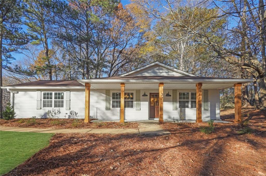 Welcome to 37 John Boy Trail – a stunningly renovated 3-bedroom, 2-bathroom HO HOA, ranch home that combines elegance with modern convenience in one of the area's most desirable communities. Set in the highly-rated Newnan County School district, this home features an inviting open floor plan, filled with natural light and timeless updated finishes. The updated gourmet kitchen is a chef’s dream, with brand-new stainless steel appliances, high-end quartz countertops, a large island, and custom cabinetry. The cozy primary suite offers a serene escape, complete with a spa-like en-suite bath featuring large vanity, and fresh tile work and fixtures. Outside, the home shines with fresh landscaping, paint job and a large, level backyard—perfect for gatherings, relaxation, or play. Additional updates include new flooring, modern lighting, and fresh paint throughout the interior and exterior, ensuring this home is truly move-in ready. The Furnace and water heater have also been replaced! Home comes included with brand new vinyl windows. Situated near shopping, dining, and parks, and with easy access to major highways, this home is a rare opportunity for great living in a prime location. Don't wait to experience all this home has to offer – schedule your private showing today and prepare to fall in love!