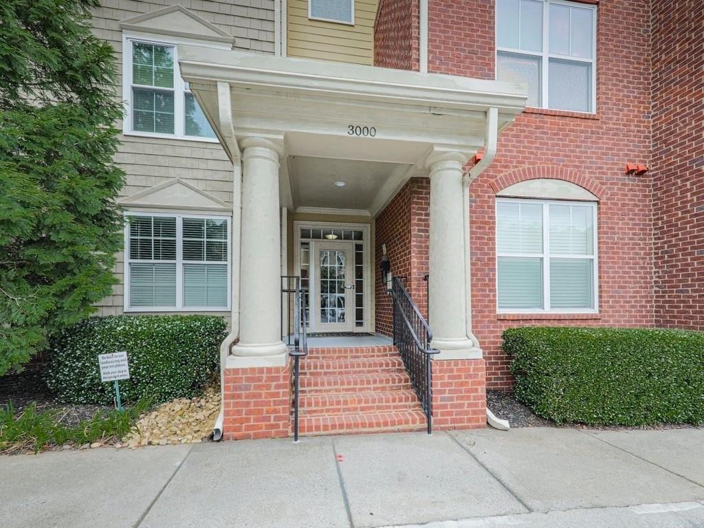 NEW IMPROVED PRICE!
Pick out your NEW flooring! Limited time to make your selection-Don't miss out! Sought after end unit with extra windows! Stepless, Secure, and Maintenance-Free Living in a Parklike Setting Enjoy the ease of living in this beautifully designed open-concept condo, ideal for those seeking comfort, convenience, and a simplified lifestyle. The recently-updated spacious kitchen features a center island, raised bar seating for two or more, elegant quartzite countertops, recessed lighting, and under-cabinet lighting—all open to the inviting family room for easy entertaining. A cozy two-sided gas fireplace warms both the family room and breakfast area, creating a welcoming ambiance throughout. As an end unit, the home is filled with natural light, thanks to windows on two sides of the main living space. French doors off the breakfast room lead to a covered balcony—the perfect spot to enjoy a morning coffee or relax in the evening. The primary suite offers a peaceful retreat with a walk-in closet and a spa-style bath featuring a soaking tub, separate “step-in” shower, dual vanities, and private water closet. A well-appointed guest bedroom includes double windows, a generous closet, and access to a separate full bathroom—perfect for visiting family or friends. Located in the sought-after Flats at Riverwalk within Wildwood, this residence combines the tranquility of a parklike setting with the benefits of secure building access and attached, covered tandem parking (space 113). Community amenities include a clubhouse with full kitchen, swimming pool, fitness center, pet areas, and walking trails. Conveniently located in coveted East Cobb near I-75 and I-285 with easy access to Truist Park: Home of the Atlanta Braves, Sandy Springs, downtown Atlanta, this home makes getting around effortless. Dining, entertainment, and essential services are just minutes away. Plus, with the HOA handling nearly all maintenance, you can enjoy a truly easy, worry-free lifestyle.