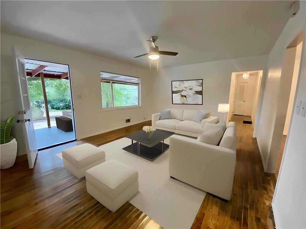 Welcome to this beautifully renovated ranch on a peaceful, tree-lined street—where classic charm meets modern comfort. Thoughtfully updated from top to bottom, this spacious home features restored original hardwoods that shine throughout, paired with coordinating luxury vinyl plank in the kitchen, dining area, and expansive primary suite for a seamless look and feel. Step into a generous living room anchored by new luxury LED lighting and an upgraded ceiling fan, perfect for both relaxing and entertaining. The dining room flows effortlessly into the updated kitchen, where you'll find sleek stainless steel appliances, stunning quartz countertops, and a deep farmhouse-style sink—all set beneath a fresh, modern design. The true standout? A sprawling primary suite that runs the full length of the home, complete with its own fireplace, private access to the backyard, and a beautifully appointed en suite bath featuring a statement soaking tub and designer lighting. On the opposite side of the home, three additional bedrooms offer privacy and versatility. Two share a fully renovated hall bath with a tiled walk-in shower, while the third enjoys the convenience of its own half bath. Outside, a newly fenced backyard is full of potential, and the oversized driveway offers ample parking. Plus, with no neighbors directly across the street, you’ll enjoy tranquil views of the trees from your front porch. All of this in a prime location—just minutes to I-285, grocery stores, and shopping, with quick access to Decatur Square, East Atlanta Village, Emory, and the CDC. This one truly checks all the boxes—schedule your showing today!