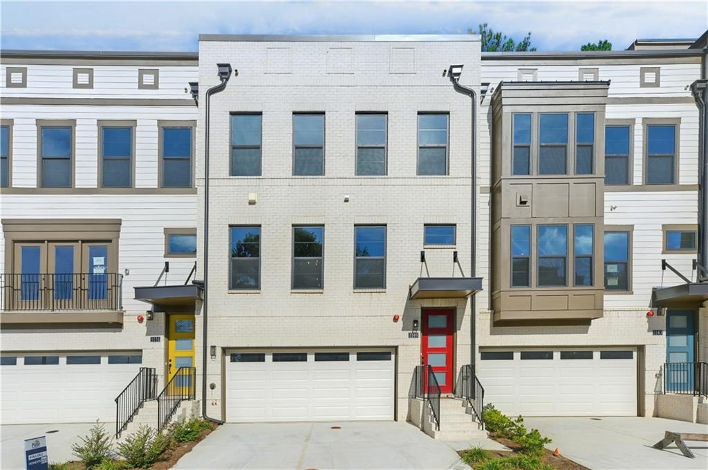 Move in ready, this beautiful Hutton floorplan townhome offers 4-story living at its finest. Enjoy 5 outdoor living spaces, and 3 indoor living areas, including a day-light basement w/patio and large yard. Open concept main floor is perfect for those family gatherings. Gourmet kitchen, with dark gray cabinets /quartz countertops, dining area, gathering room, sunroom and deck allow for ultimate flow. Upgraded interior features throughout: gas appliances, quartz countertops, soft-close cabinetry, and a spa-like bath, with rain shower in Owners Bath. Top floor Loft with rooftop front & rear decks are perfect for entertaining. Community pool, lots of greenspace and sidewalks. Location is outstanding, with easy access to 285 and 75. Only 10 minutes to Midtown/Downtown/Buckhead.