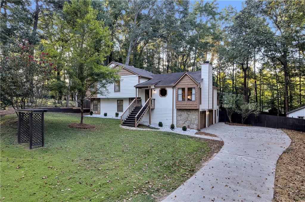 Discover comfort, space, and community living in this beautifully updated 4-bedroom, 3-bath home, plus multiple bonus romos, nestled in the quiet, established Sherman Ridge neighborhood of West Marietta. Set on a rare 1.27-acre lot, this property offers privacy, room to grow, and a true connection to nature without sacrificing convenience. Zoned for top-rated Cobb County schools—Still Elementary, Lovinggood Middle, and the highly sought-after Hillgrove High School, it’s perfect for families who value excellent education in a serene setting.
Enjoy everyday ease with quick access to shopping, dining, and essentials, and spend weekends exploring Laurel Park, Kennesaw Mountain National Battlefield Park, or the charm of Downtown Marietta just 15 minutes away. Inside, you’ll find new flooring, fresh interior and exterior paint, quartz countertops, and new appliances throughout. The flexible split-level layout features spacious living areas, a cozy fireplace, and multiple bonus spaces including a sunroom and family room.
Outdoors, the expansive fully fenced backyard is ideal for entertaining, pets, or play, and includes a large deck, side porch, dedicated workshop, and oversized shed, perfect for storage, hobbies, or creative projects. A two-car side-entry garage, level driveway, and ample parking complete this move-in ready home.
Don’t miss your chance to own this updated home with acreage, privacy, and room to breathe, schedule your private tour today!