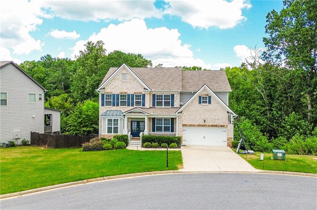 Step into this beautifully maintained 5 bedrooms, 4 bathrooms home nestled at the end of a quiet cul-de-sac, offering space, comfort, and style for modern living. As one of the few Fieldstone floorplans in the neighborhood, it boasts a soaring vaulted ceiling in the living room that instantly makes a grand impression. The home features an open layout ideal for entertaining, with a spacious stone kitchen island at its heart—perfect for casual gatherings or lively dinner parties.
What makes this home even more attractive is the assumable mortgage at an incredibly low 4.2% interest rate—an exceptional opportunity in today’s market, where average rates are over 6%. Inside, the owner’s suite is a private retreat with elegant crown molding, French doors, and a generous sitting area. The custom-designed walk-in closet is thoughtfully built to accommodate an extensive wardrobe, including shoes, bags, and accessories.
Upstairs, one bedroom enjoys its own bathroom and custom closet, while the remaining two bedrooms share a convenient Jack-and-Jill bathroom. A guest bedroom and full bathroom are also located on the main level, offering ideal accommodations for visitors or extended family.
The finished basement expands your living space with a dedicated office, a movie room, a playroom, and a sprawling family room—perfect for work, relaxation, or recreation. Outside, enjoy the privacy of a large, level, fenced backyard—an ideal spot for pets, play, or simply unwinding under the sky.
Located in the desirable West Forsyth school cluster and just minutes from Midway Park, Big Creek Greenway, Sawnee Mountain, YMCA, Vickery Village, and top shopping destinations, this home offers the complete package of location, lifestyle, and value. Come see it today before it’s gone!