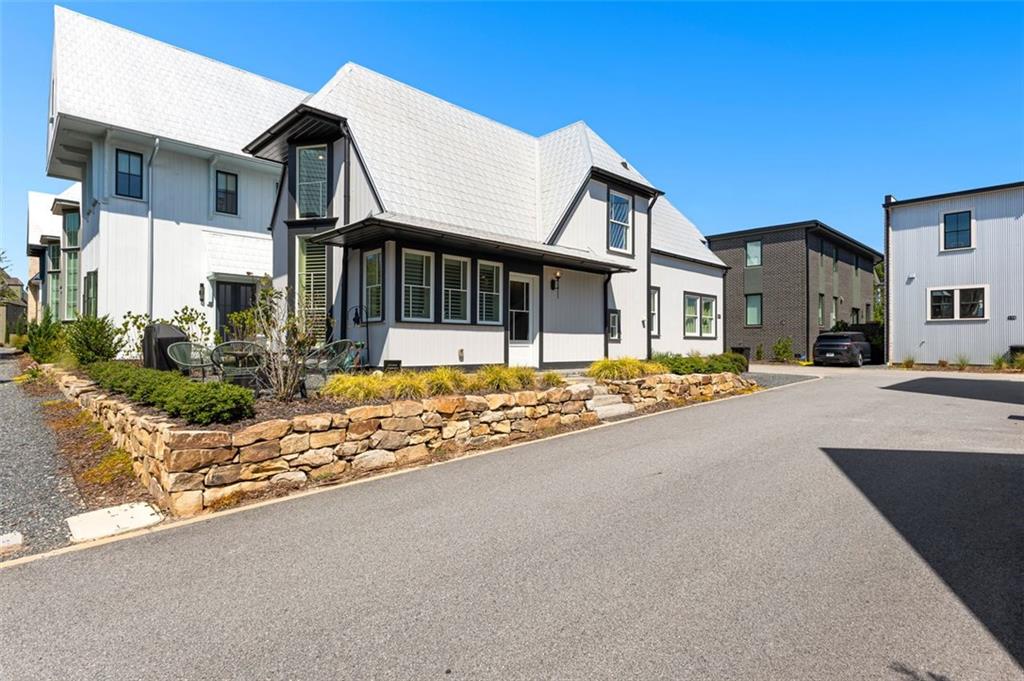 Welcome to this stunning 3 bedroom, 3 full bath home in the heart of Trilith! Designed with flexibility in mind, you’ll love the option of a primary suite on the main level or upstairs. The home is positioned perfectly near one of Trilith's outdoor living parks, giving you the ability to enjoy outdoor living without all of the work!
The light-filled open living and dining space features soaring ceilings, hardwood floors, and floor-to-ceiling windows with remote-controlled blinds and custom window coverings. The kitchen boasts stainless steel appliances, stone counters, and a pantry — perfect for everyday living and entertaining.
Upstairs you’ll find a second primary suite with a spa-inspired bath and walk-in closet, plus a versatile loft/flex space for a home office or lounge. Outdoor living is easy with a private patio where you can host family and friends, while two dedicated parking spaces add convenience.
As part of Trilith, you’ll enjoy world-class amenities: 15 miles of walking trails, resort-style pool, tennis courts, pocket parks, a state-of-the-art wellness center, dog park, and the vibrant Town Centre with dining, shopping, and entertainment just steps away. Perfectly located across from Trilith Studios and minutes to Peachtree City, the airport, and Atlanta — this home offers the best of live, work, and play!