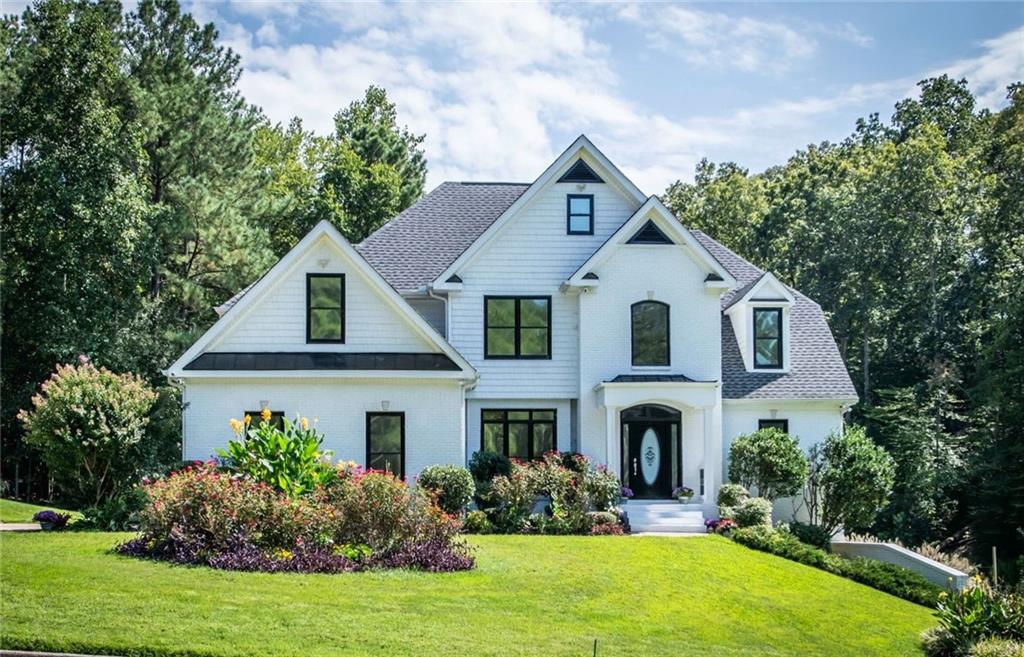 Gorgeous custom home with 3 lots for approx. 3.7 acres in sought after Paulding county. The upper lot is buildable so you could start a family compound or build a second home. The private back yard slopes gently to a charming creek which attracts deer and wildlife. The yard boast a park like Setting, garden w irrigation and orchard. The front of home is level and to the side is a Putting green for the golf enthusiast ! There is also a fenced in dog run for your fur babies!
This home is newly remodeled and is ready to move in. This custom estate has a spacious and open floor Plan. The great room has a view to kitchen and breakfast room and deck. Custom granite counters and stainless steel appliances in chefs gourmet kitchen. Large deck for grilling and family gatherings. Family Rm has warm fireplace for Winter hot toddies.
The master on main is spacious and has a brilliant walk in cedar closet. The master bath has a Jetted tub and walk in shower and custom steam shower. There is an additional bedroom and full bath on main level for either mother in law or private office or work out room, The second floor has 3 spacious bedrooms and 1 full baths for family and friends. A total of 6 bedrooms if needed or 5 bedrooms and office.
The basement is designers dream and fully finished. It could be a separate living quarters For an extended family or mother in law apartment. It has 2 sliding barn doors and custom siding. It has a large bedroom , family room, sun room or work out room, and kitchenette. There is an office or dining area off kitchenette with custom barn wood siding. The bathroom is Awesome with double shower heads and double vanities. The family room opens to private covered patio and beautiful back yard. A Compact work shop with double door (boat door) And shelving is also in basement. The upstairs garage has epoxy flooring and more shelves for storage. There is ample parking available. During inclement weather you will not lose power due to 20 kw Generac generator.
There are too many upgrades to list.
This park like setting has approx. 60 x 20 ft fenced pen for you fur babies or for Chickens!!
There is an adorable chicken home with automatic feeders attached to fenced pen and netting for covering the pen.
The orchard boast: apple trees, fig trees, blueberry bushes , etc... You can build memories to cherish on this estate!
This is a deer hunters, bird watchers, and nature lovers paradise ! Fun for 4 wheelers too!