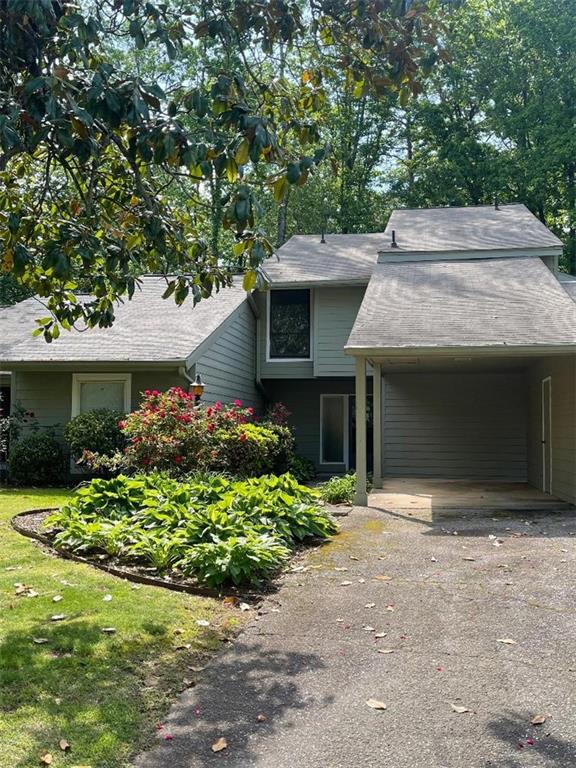 Prime location townhome located in a small, private enclave of on a cul-de-sac street in an excellent school district, and minutes from shopping, GA400 highway, malls, restaurants, Northpoint Mall, popular Avalon, downtown Alpharetta with its trendy shops, restaurants and entertainment, and Ameris Bank Amphitheater. The main level features a living room with fireplace, dining area, kitchen with breakfast bar, window over sink and white cabinets, family room, laundry room, a guest bath, and two private patioa. On the second level you will find three bedrooms and two bathrooms, and a walk-in closet in the primary bedroom. The vaulted ceilings, and many windows allow light and a feeling of spaciousness throughout, and ample closets/storage. The carport has an adjacent storage room, and the driveway accommodates guest parking. This sought-after location is in an area of higher-value homes, and endless conveniences. The community pool provides the opportunity for relaxation, fun for the kids, and socializing with neighbors.