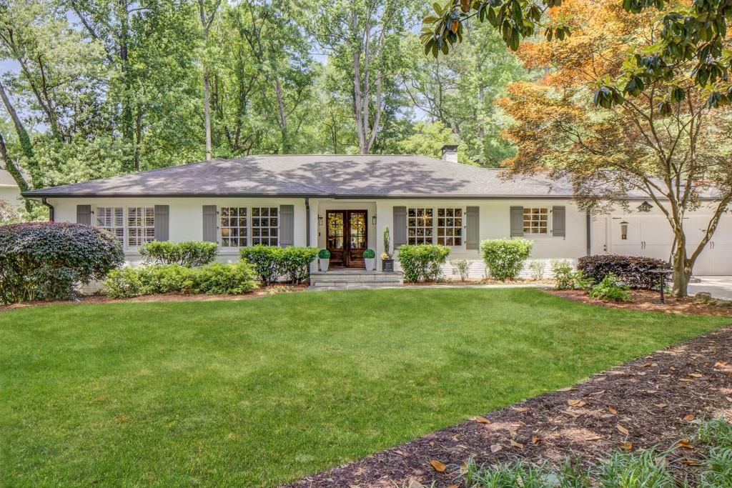 BUYER’S DELIGHT! Fantastic Home in MORRIS BRANDON school district! Located on Peachtree Battle Avenue, this home is fully RENOVATED and has been meticulously maintained. DURING THEIR OWNERSHIP: WHOLE HOUSE GENERATOR, NEW ROOF, GUTTERS, DOWNSPOUTS, SOFFITS, KITCHEN, BATHS, FINISHED TERRACE LEVEL, NEW LAUNDRY ROOM, SEWER LINE, DECK, SOD, BLUESTONE WALKWAY, FOAM INSULATION, DUCTWORK, REFINISHED HARDWOODS, and WINDOWS - * see attached renovation list. Turnkey and move-in ready in EVERY WAY! Large FLAT front and back yard with lush professional landscaping. Permanent stairs to attic if you want to go up - the newly finished basement has an office/ 4th bedroom with built in bookshelves and barn doors, 5th bedroom and full bath. The bar area has a full-size wine cooler, refrigerator drawers, icemaker, and microwave - and new laundry room with ample counter space and cabinets. In addition, there is still plenty of unfinished space for storage. Primary suite has an abundance of windows and a soaring ceiling making the room feel airy and bright. Custom built-ins and walk-in closet provide plenty of space and the renovated bath with soaking tub overlooking the backyard and large frameless glass shower complete this owner’s retreat! Two secondary bedrooms are ample size and overlook the front yard. Expansive wall of built in bookshelves and desk area in main hallway lead to the main living area with double sided fireplace that shares with the breakfast room. Breakfast room has French doors that lead out to the brand-new deck with inviting steps down to the beautiful backyard. Kitchen has been renovated with marble countertops, tile backsplash, gas stove. Formal Dining room completes this floor and will be a perfect place to host many fun gatherings! This home is amazing in every way - it will not last long! ** Sellers have additional RENOVATION PLANS to add a mudroom, half bath, walk-in pantry, screened porch with fireplace, and extend existing breakfast room PLANS WILL CONVEY WITH THE SALE OF THE HOME!