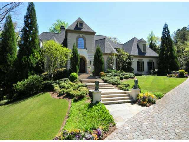 TRULY AN INCREDIBLE HOME ON ONE OF THE BEST PIECES OF PROPERTY - 3+/- ACRES OF GARDENS, POND, WATERFALLS, WALKWAYS ALL W/TOTAL PRIVACY. SPECTACULAR INTERIOR W/ONLY THE FINEST FINISHES-GREAT ATTENTION TO DETAILS. DOMED ENTRY FOYER. KPING RM KITCH/HM THEATER/PALATIAL GUEST SUITE/LIBRARY/LIVINGRM-A RM