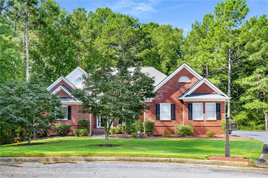 Welcome Home, Look No Further! This stunning 4BR/3.5BA brick ranch on a full basement is located in The Oaks Brentwood swim and tennis community. Customized to the owner's request, you will love this John Weiland built home. This beautiful one owner home is well maintained, and boasts a spacious floor plan that is ideal for families, relaxation, and entertaining. As you enter the home, you are greeted by gleaning hardwood floors in the foyer, dining room, kitchen, family room, and hallways. The kitchen offers new stainless steel appliances, quartz counters, tile backsplash, and a separate eat-in kitchen area easily accessible to the family room, enclosed climate controlled sunroom, and expansive deck. 3 sizable bedrooms and 1.5 bathrooms accompany the master suite on the main level. A pleasant surprise awaits you as you descend to the finished basement that is complete with: boat/storage room with garage door, flex room, media room, game room, kitchen, wet bar, and full bathroom. The outdoor living spaces are very captivating and includes an upper deck and lower level patio that provide views & access to the large backyard that is also perfect for entertaining, relaxing, and gardening. This home offers great curb appeal with its professionally landscaped yard that is situated on 0.55 acres at the center of a cul-de-sac, offering privacy and reduced through traffic. Close proximity to shopping, dining, and entertainment options. Great location and close to restaurants, shopping, and schools. This home is truly move-in ready and awaits it's new owner. Don't miss this one! 100% FHA Loan financing available with Ameris Bank.