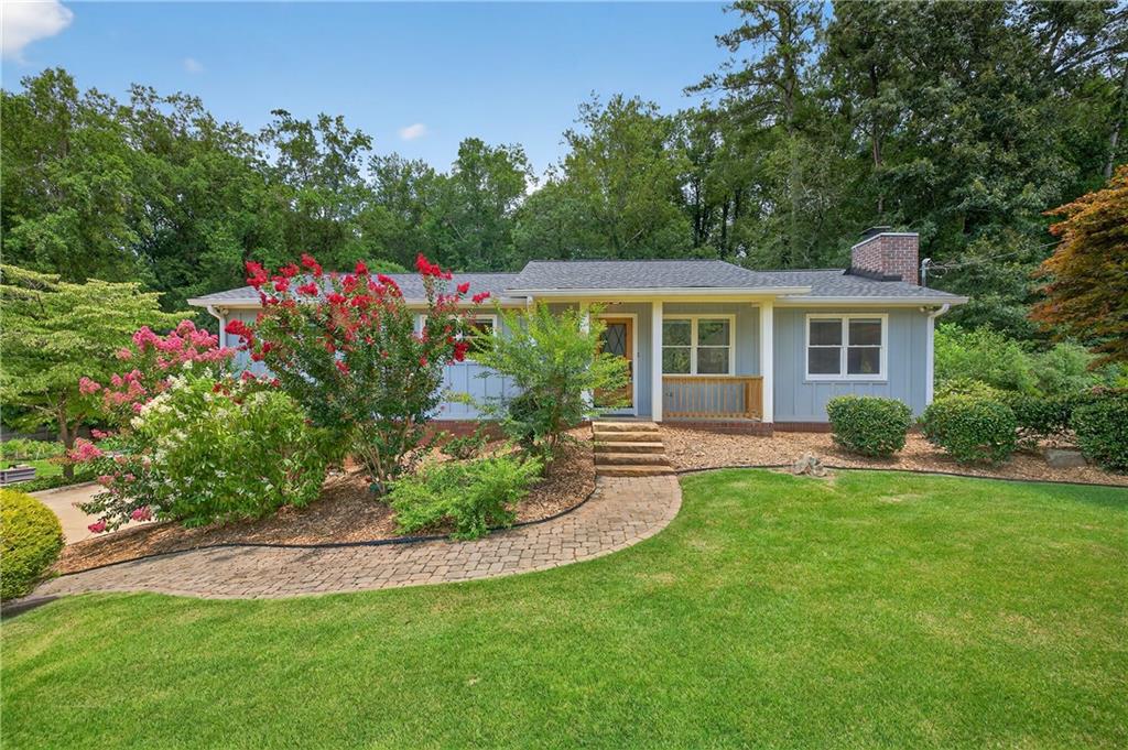 Get ready to fall in love with this absolutely stunning, fully renovated ranch home at 3330 Ranch Road in Marietta, GA! Tucked away in the super popular North Forty subdivision, this property offers an incredible opportunity for modern living. This isn't just a quick refresh; it's a complete transformation. We're talking top-to-bottom newness, designed for today's living. This includes all new electrical, plumbing, HVAC and ductwork, drywall, rock wool insulation, exterior siding, windows and more! Step inside and you'll immediately notice the gorgeous new LVP flooring flowing seamlessly through every room, brightened by sleek LED lighting. The kitchen is a dream come true for anyone who loves to cook, boasting sparkling quartz countertops, brand-new cabinets, and that eye-catching stainless steel farmhouse-style sink. The family room is super cozy, centered around a charming gas-log fireplace flanked by stylish shelving and smart storage-perfect for kicking back or hosting friends. Every part of this home feels fresh and new, from the beautifully tiled showers in the updated bathrooms to the inviting bedrooms and spacious closets. The finished partial walkout basement is a huge bonus, complete with its own new mini-split heating and cooling system, making it an ideal spot for anything you need-a home office, gym, media room, or even an extra hangout space. Beyond the pretty finishes, you'll find some serious upgrades for comfort and efficiency. There's a new tankless hot water system for endless hot showers, and an RO Water Filtration system means pure, delicious water right from your tap. You'll be thrilled to know that this property also comes with the significant advantage of NO HOA DUES, providing true freedom and flexibility for homeowners. Outside, the home has fantastic curb appeal with its fresh board and batten siding. You'll love the convenient 2-car side-entry garage, too. But the real showstopper? The incredible fenced-in backyard! It's a private oasis, beautifully professionally landscaped front and back, just waiting for you to enjoy. Finding a fully renovated home with these kinds of premium features in Marietta is a rare gem right now. You absolutely have to see this one to believe it. Give us a call to schedule your showing appointment today!