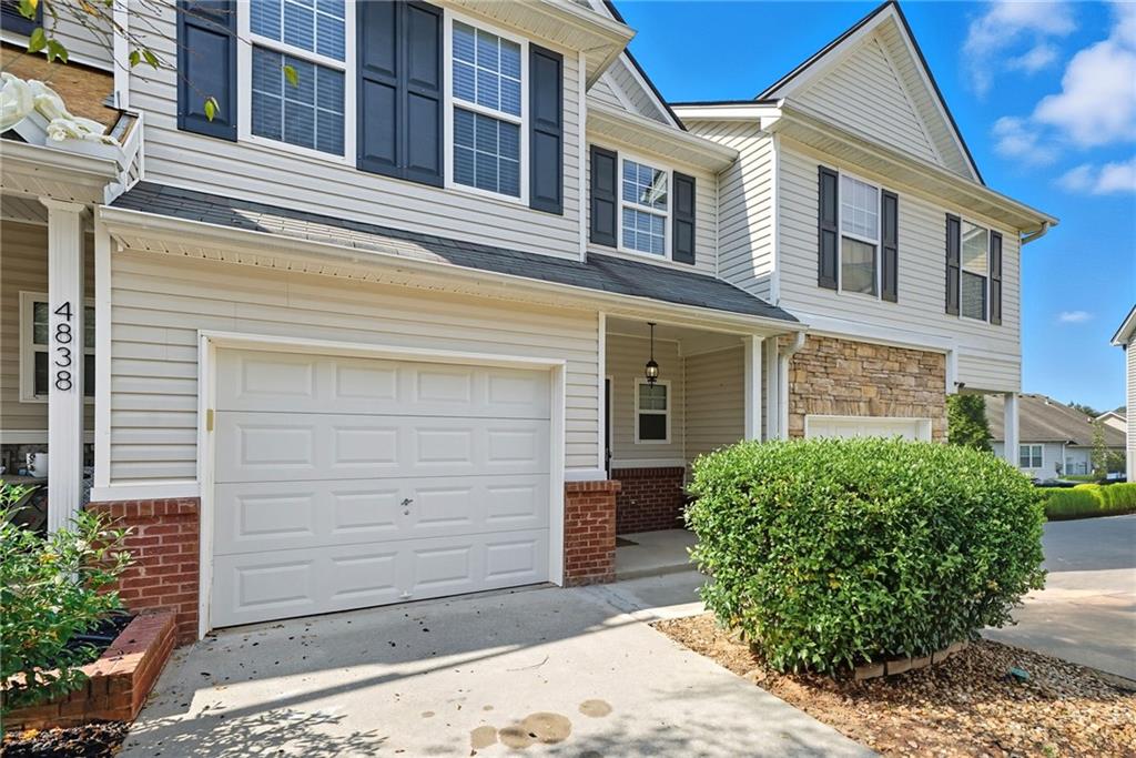 Awesome 2 bed, 2.5 bath townhome located in the highly sought-after Waterstone Crossing community! Perfectly situated near I-985, shopping, dining, schools, and beautiful Lake Lanier—you can even walk to Hideaway Bay Marina.
Step inside to an open-concept main floor featuring brand-new flooring throughout. The spacious kitchen boasts a large island, perfect for meal prep or entertaining, and flows seamlessly into the dining area with French doors leading to the back deck. A cozy family room and convenient half bath complete the first level.
Upstairs, you’ll find two oversized master suites, each with vaulted ceilings, private en suite baths, and plenty of closet space. Laundry is also located upstairs for convenience.
Enjoy outdoor living on the covered front porch or relax and entertain on the large back deck. This townhome has everything you need—don’t miss out on this great opportunity!