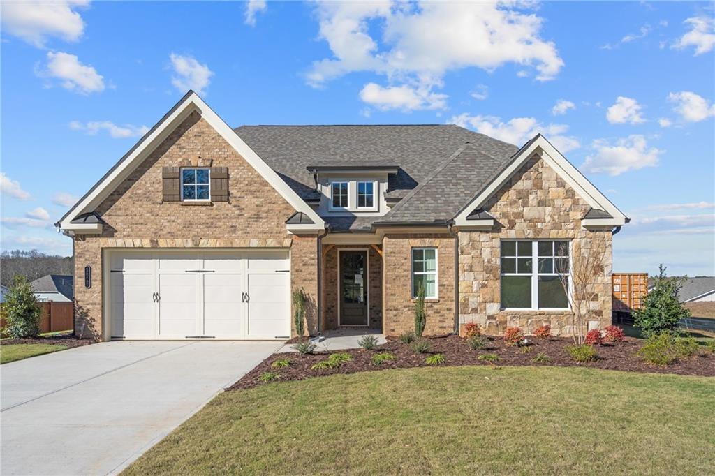 Up to $20,000 in incentives with our preferred lenders for a limited time! Discover the Rosehill, a meticulously crafted 4-bedroom, 3.5-bath home with a 3 car tandem garage by SR Homes in Forsyth County, GA! This stunning 3,266 sq. ft. residence offers the perfect blend of luxury and function with high-end finishes throughout. The main level is designed for easy living and entertaining, featuring an impressive living room with soaring 12-foot coffered ceilings that add elegance and grandeur. Adjacent to the living area is a formal dining room, perfect for hosting family gatherings or dinner parties. The gourmet kitchen is equipped with quartz countertops, double ovens, under-cabinet lighting, and slow-close cabinets, seamlessly connecting to the dining and living spaces. This floor plan provides convenient main-level living, with a luxurious master suite, two guest rooms, and 2.5 baths on the first floor. The master suite offers a true retreat with a spa-inspired bathroom featuring quartz countertops and a zero-entry shower Upstairs, you'll find a versatile loft space ideal for a second family room, home office, or playroom, as well as an additional bedroom and full bath—perfect for guests or extended family.