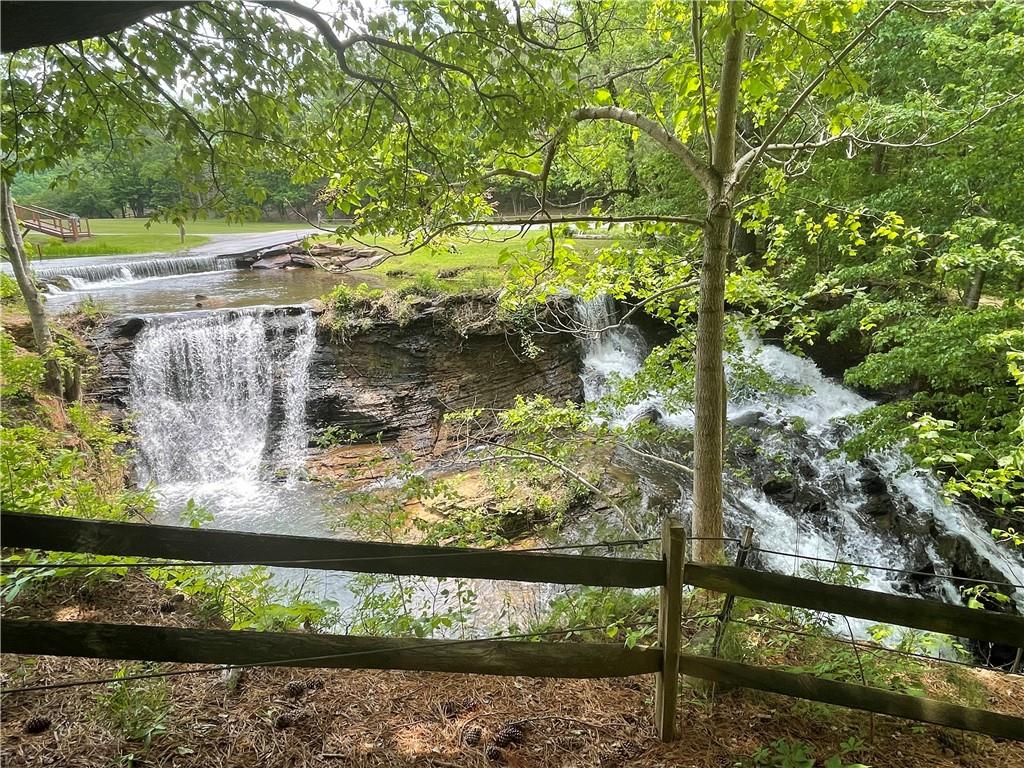 1225-1227 Oglethorpe Road - Come and discover mountain living for yourself at Bent Tree Community, where nature, amenities, and community come together to create an exceptional living experience. This corner lot is situated in one of North Georgia’s most picturesque Communities. Ready for a buyer to build their permanent home or a place to bring the family to visit for holidays and make memories.
Nestled amidst the picturesque North Georgia mountains, Bent Tree Community is a hidden gem waiting to be discovered. With its serene natural beauty, charming amenities, and a warm sense of community, Bent Tree offers an unparalleled mountain living experience. Immerse yourself in the stunning surroundings of this mountain haven. Bent Tree is enveloped by miles of hiking and biking trails, pristine lakes, and lush forests, providing endless opportunities for outdoor adventures. Whether you're an outdoor enthusiast or simply seeking tranquility, Bent Tree has something for everyone. Amenities include a 18 hole championship golf course, outdoor and indoor tennis/pickleball courts, two pools, clubhouse, restaurant, stables and 110 acre pristine Lake Tamarack with beach as well as the recreation area (bocce ball, basketball court, beach volleyball, shuffleboard court, playground, and pavilion). If you enjoy the outdoors, get on the lake with a kayak or go fishing or hike one of the scenic trails! Exercise classes (water aerobics, Pilates, yoga, Tai Chi, Qi Gong), walking and hiking clubs, craft clubs, social clubs, concerts on the beach, music events at Club Tamarack, and parties throughout the year.