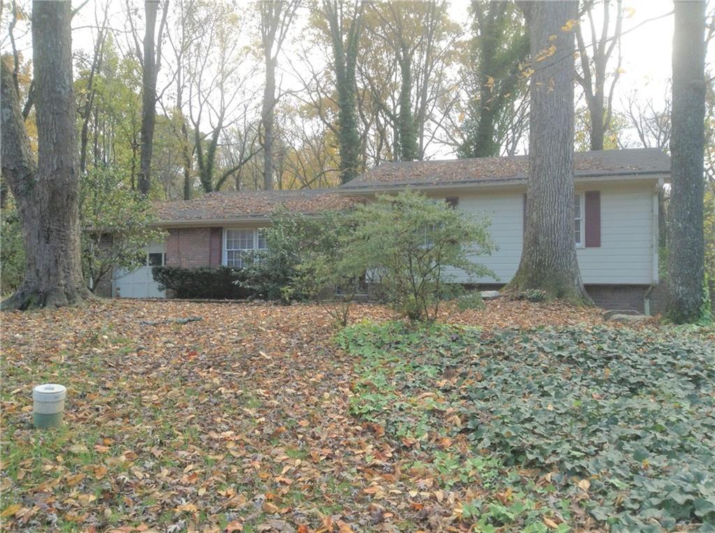 This split level home has some beautiful updates. Some features of this home include: hardwood floors throughout main living area, huge tiled den that can double as a 4th bedroom, large private lot, large enclosed porch to enjoy the backyard & entertain, spacious bedrooms, plenty of extra storage. This home is situated close to plenty of restaurants, shopping and has quick highway access. Close to everything that Smyrna and SunTrust Park have to offer. Convenient to everything. Excellent Smyrna schools (Teasley Elementary).