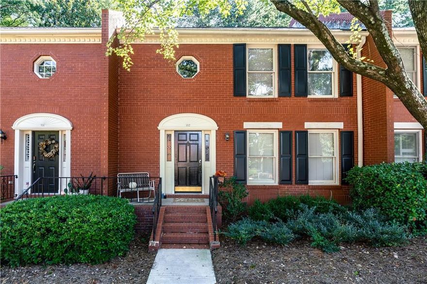 Come fall in love with this sun-splashed Defoors Mill townhome, freshly painted with brand-new carpet installed, in a quiet, friendly pocket of the Upper Westside where life feels easy and everything you need is close by. A charming front porch leads into a bright, generously sized family room with hardwood floors and updated lighting that sets a warm, modern tone. The dining area’s plantation-style blinds frame soft natural light, while the chef-pleasing kitchen features stainless steel appliances, granite counters, and a gas range, all set against a serene view of your private, fenced-in patio, perfect for morning coffee or alfresco dinners. A chic powder room sits adjacent to the laundry closet, featuring a playful peach accent wall. Upstairs, the peaceful primary retreat overlooks treetops and includes a custom closet system and a beautifully tiled, glass-door shower. Across the hall, a spacious second suite offers a tub/shower combo and a walk-in closet with a window and built-in storage, ideal for guests, a roommate, or a dedicated office. Parking is easy with one assigned space and plentiful guest parking just steps away. You’re minutes to parks, golf, favorite restaurants, breweries, shopping, and quick connectors to I-75/85, convenient to Buckhead, West Midtown, Westside Market, Cross Creek Golf Club, and more. With top-rated Morris Brandon Elementary nearby and easy access to downtown and the airport, every part of life is at your fingertips. This isn’t just a place to live, it’s a place to belong. Schedule your private tour today!